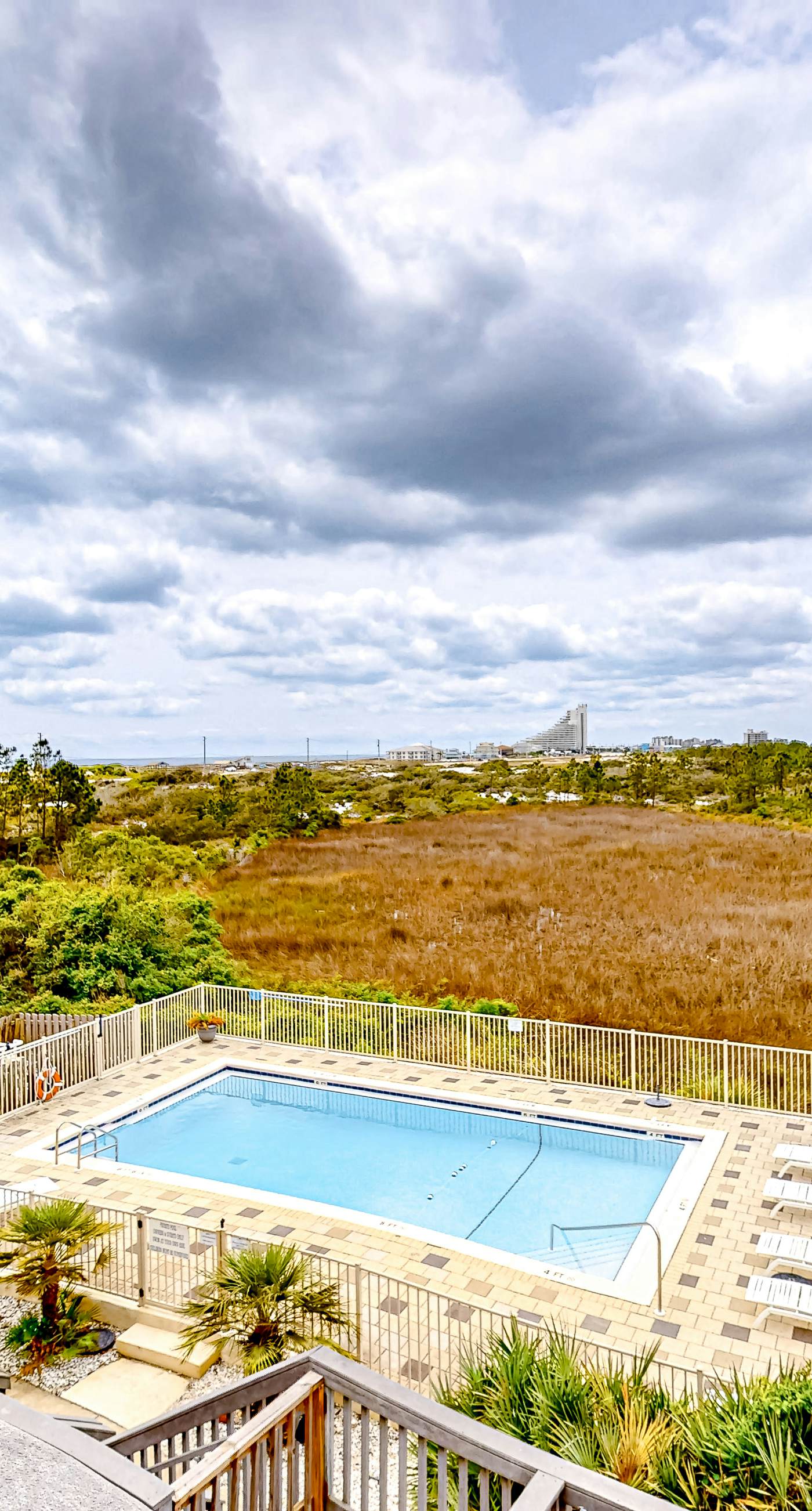 Inviting home with pool, Gulf view, tennis, patio, central AC, & W/D