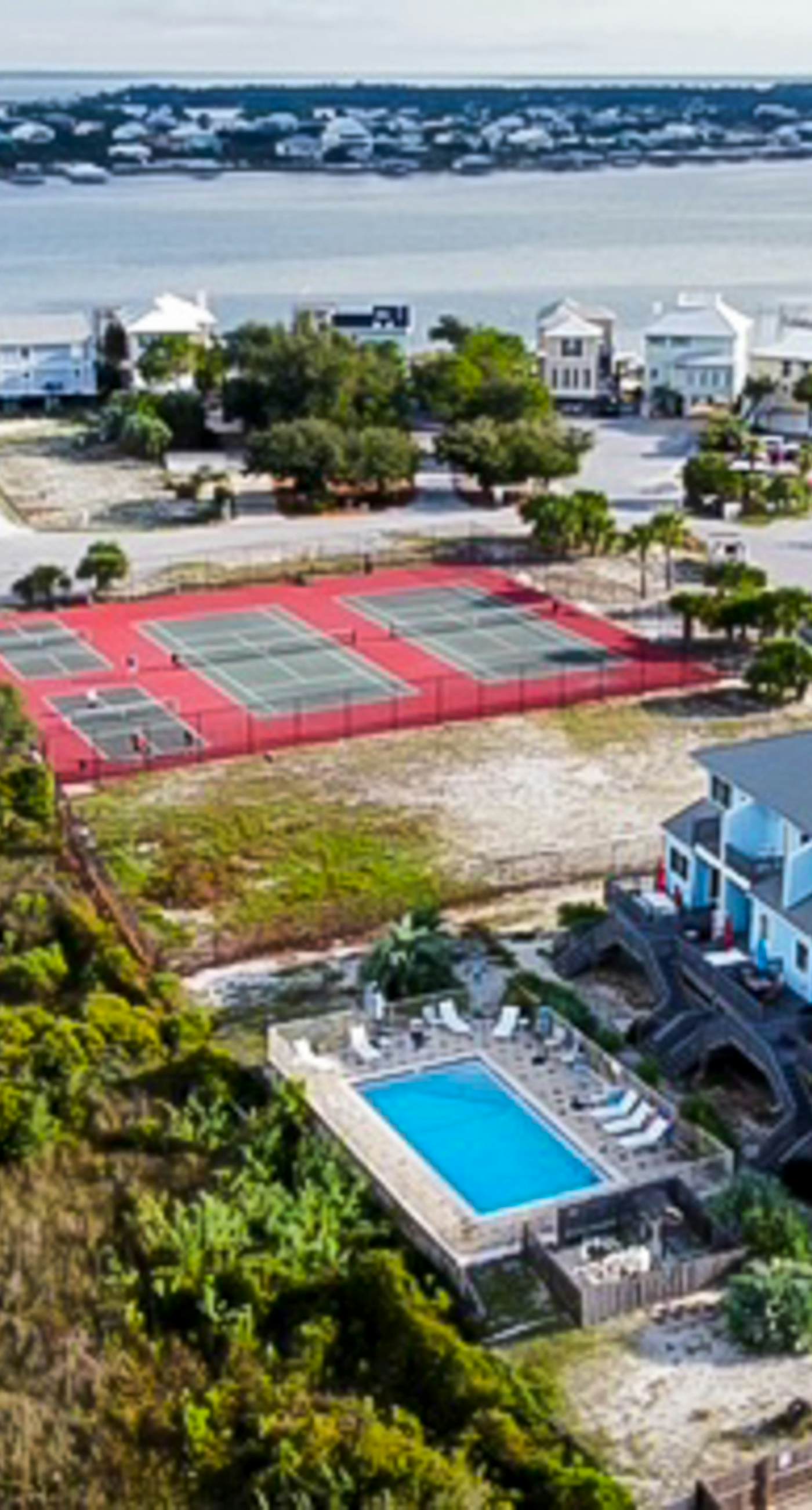 Inviting home with pool, Gulf view, tennis, patio, central AC, & W/D