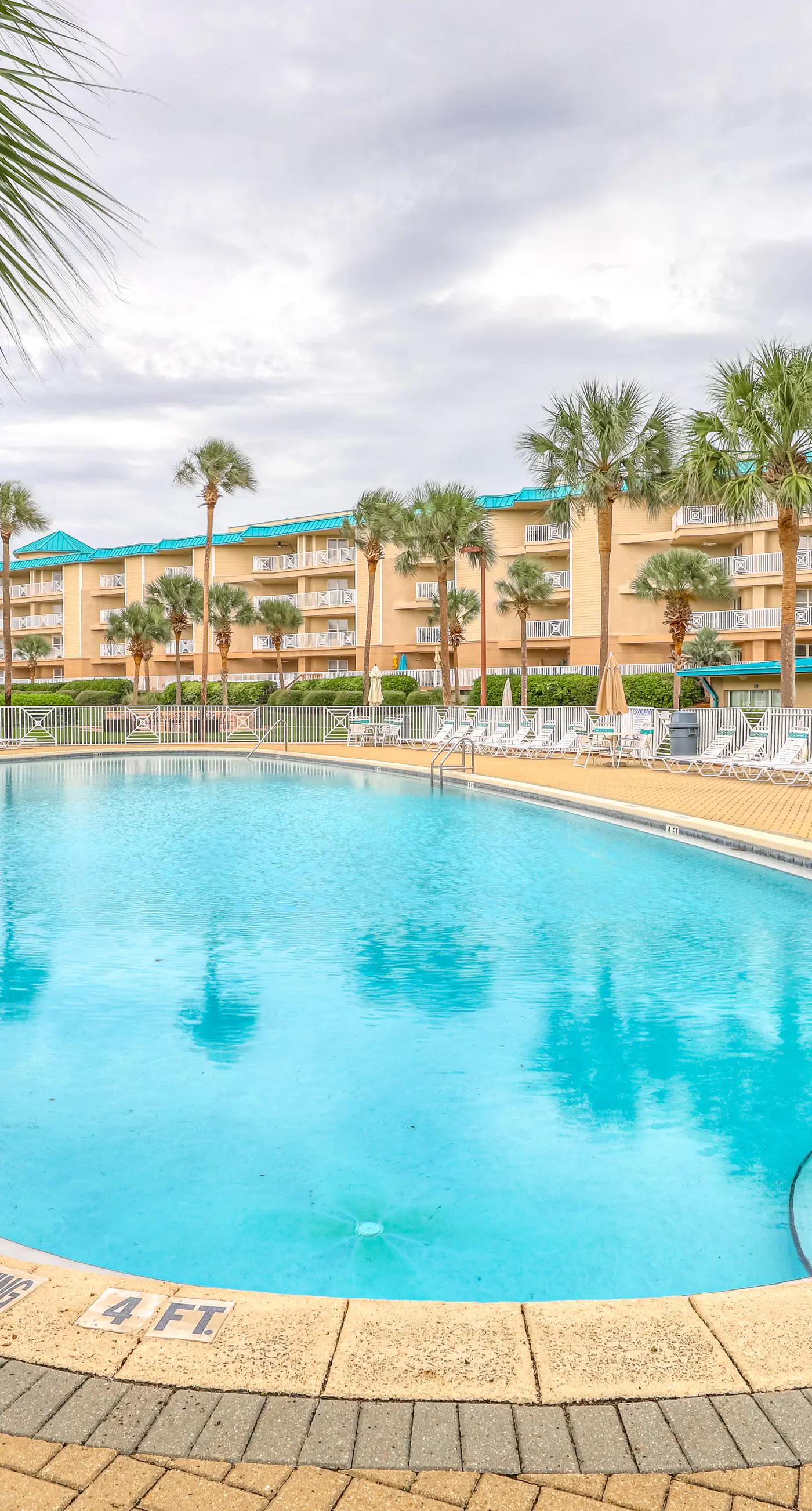 Fourth-floor, ocean-view condo with pool, high-speed WiFi, beach access & W&D