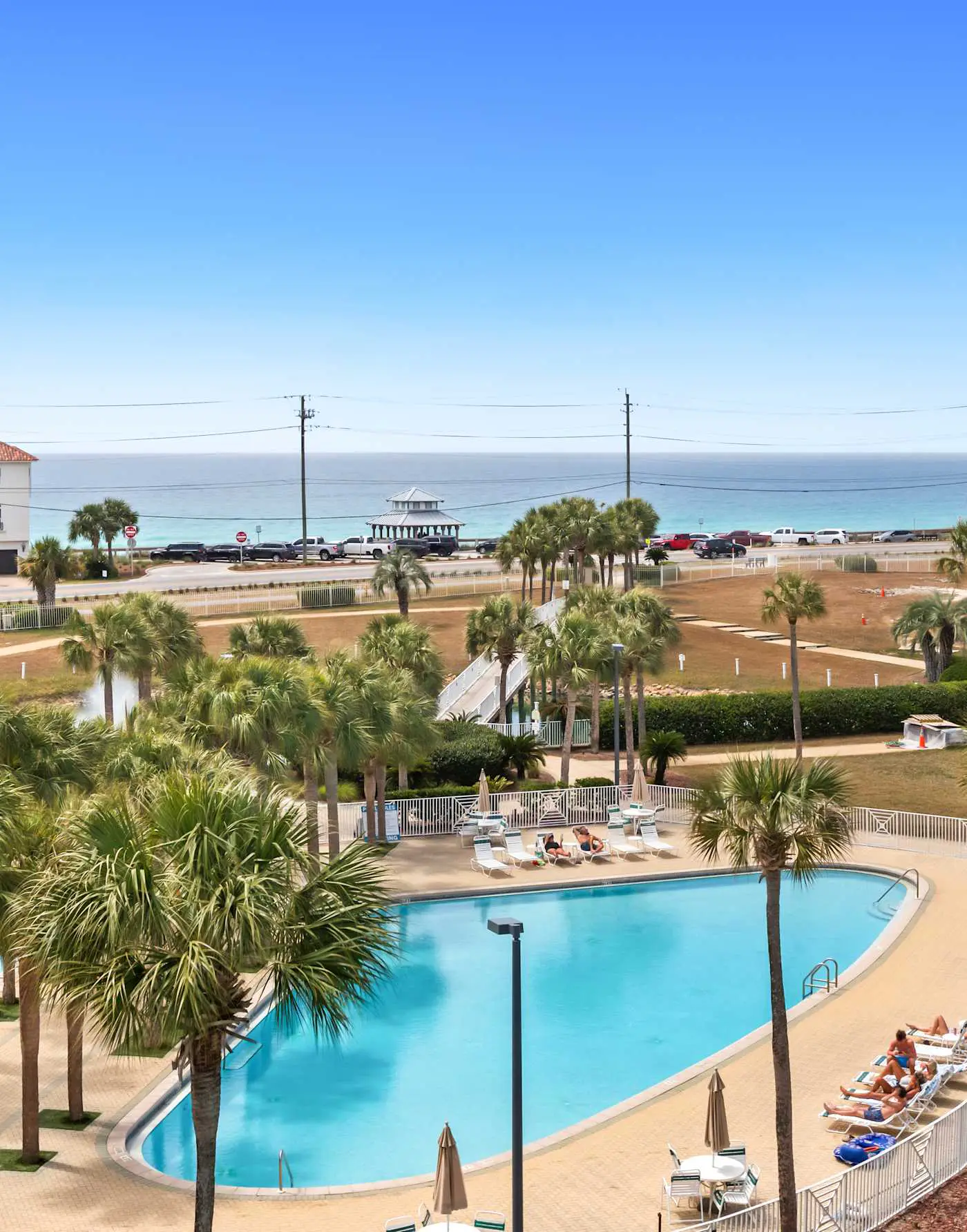 Fourth-floor, ocean-view condo with pool, high-speed WiFi, beach access & W&D
