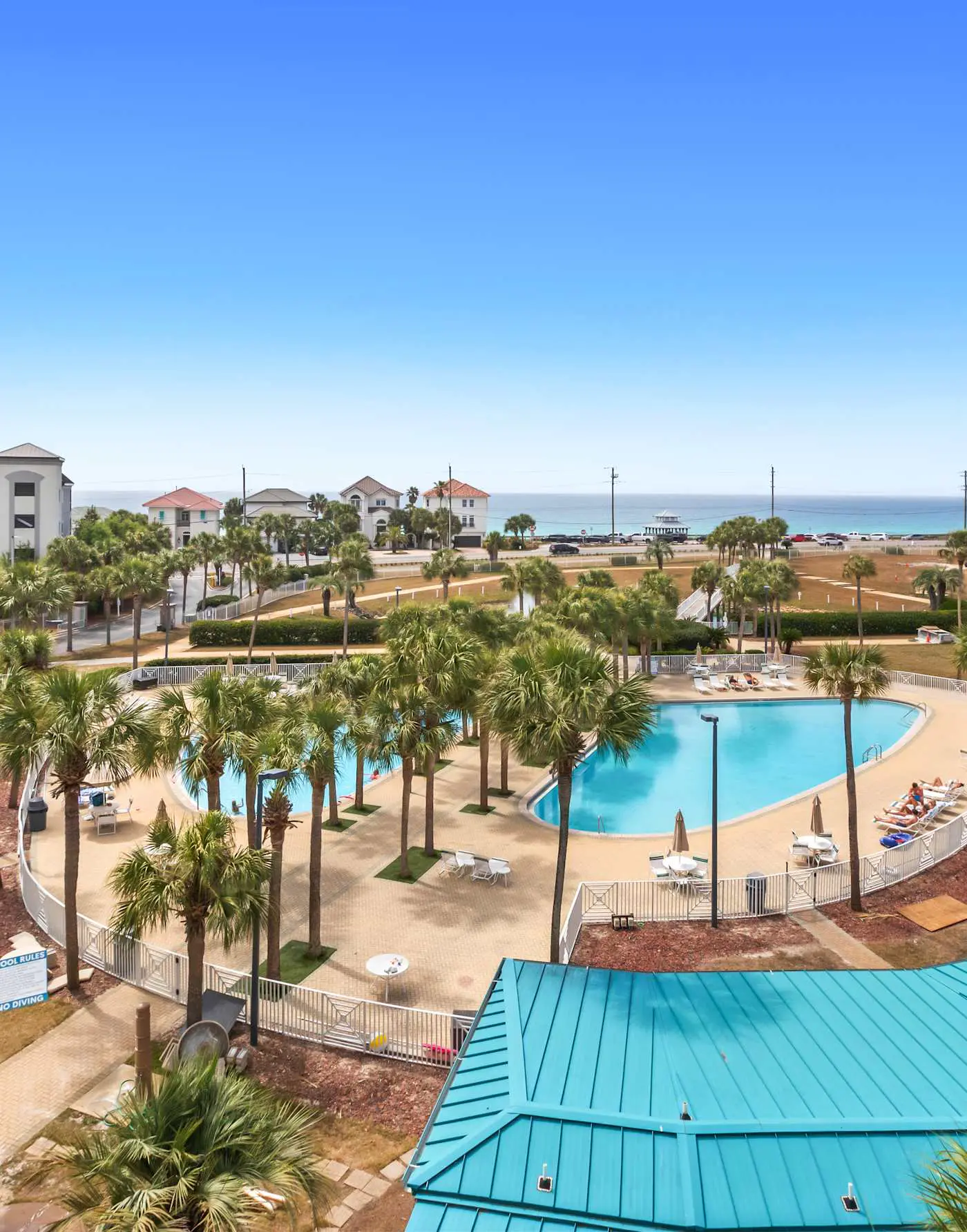Fourth-floor, ocean-view condo with pool, high-speed WiFi, beach access & W&D