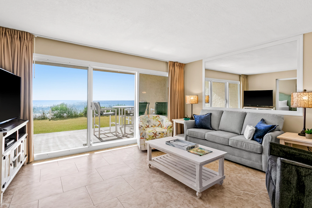 Ground floor oceanfront beachy condo with furnished patio, outdoor pool, gym