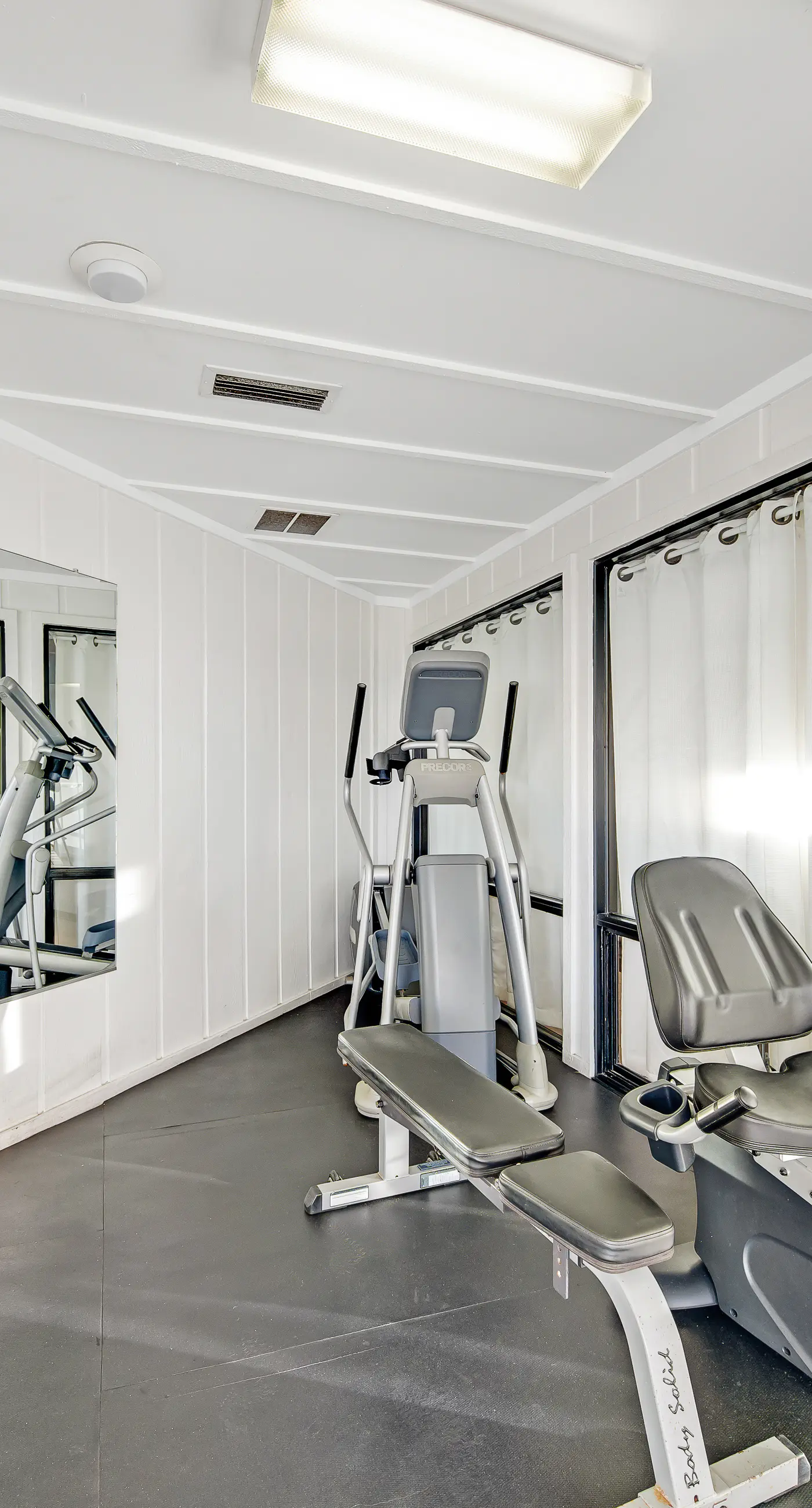 Ground floor oceanfront beachy condo with furnished patio, outdoor pool, gym