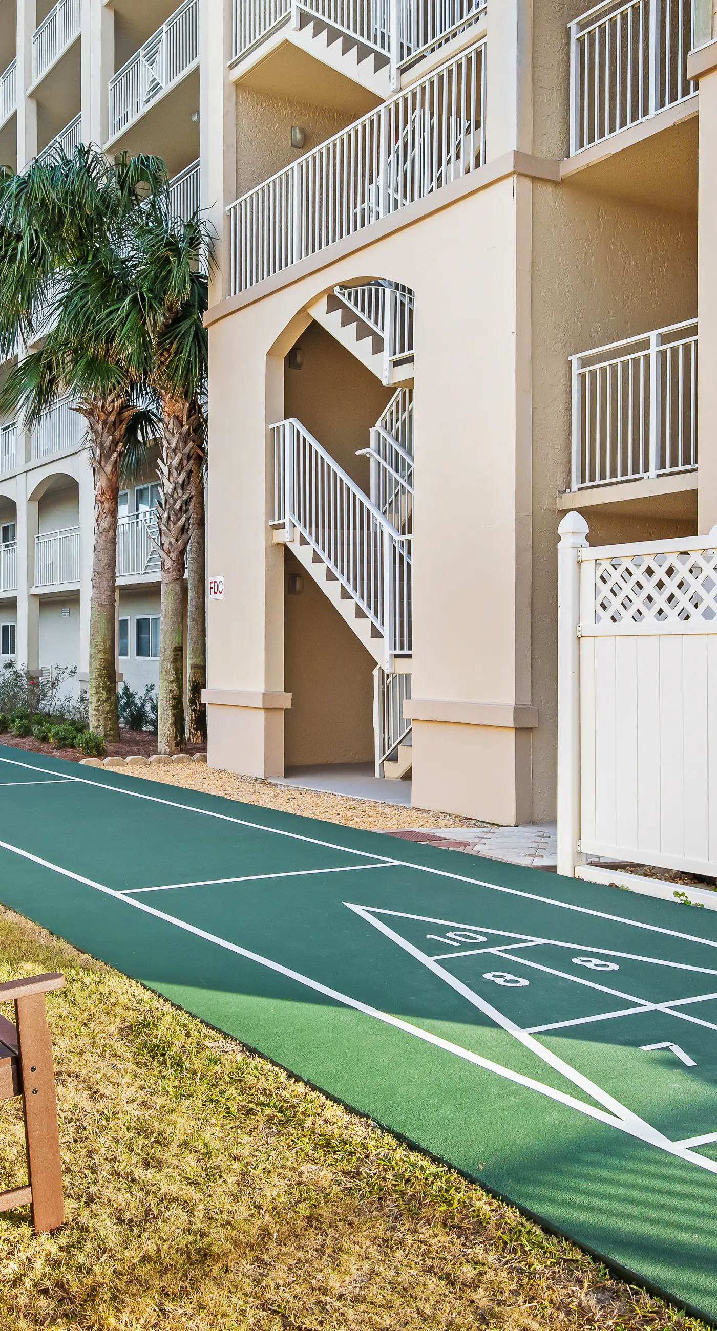 Ground floor oceanfront beachy condo with furnished patio, outdoor pool, gym