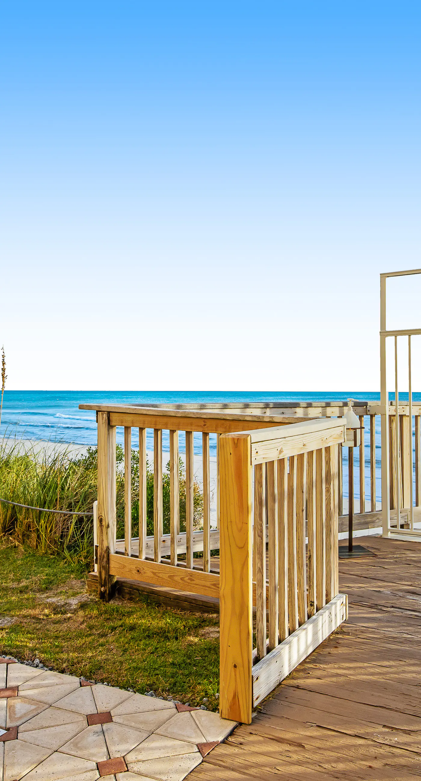 Ground floor oceanfront beachy condo with furnished patio, outdoor pool, gym
