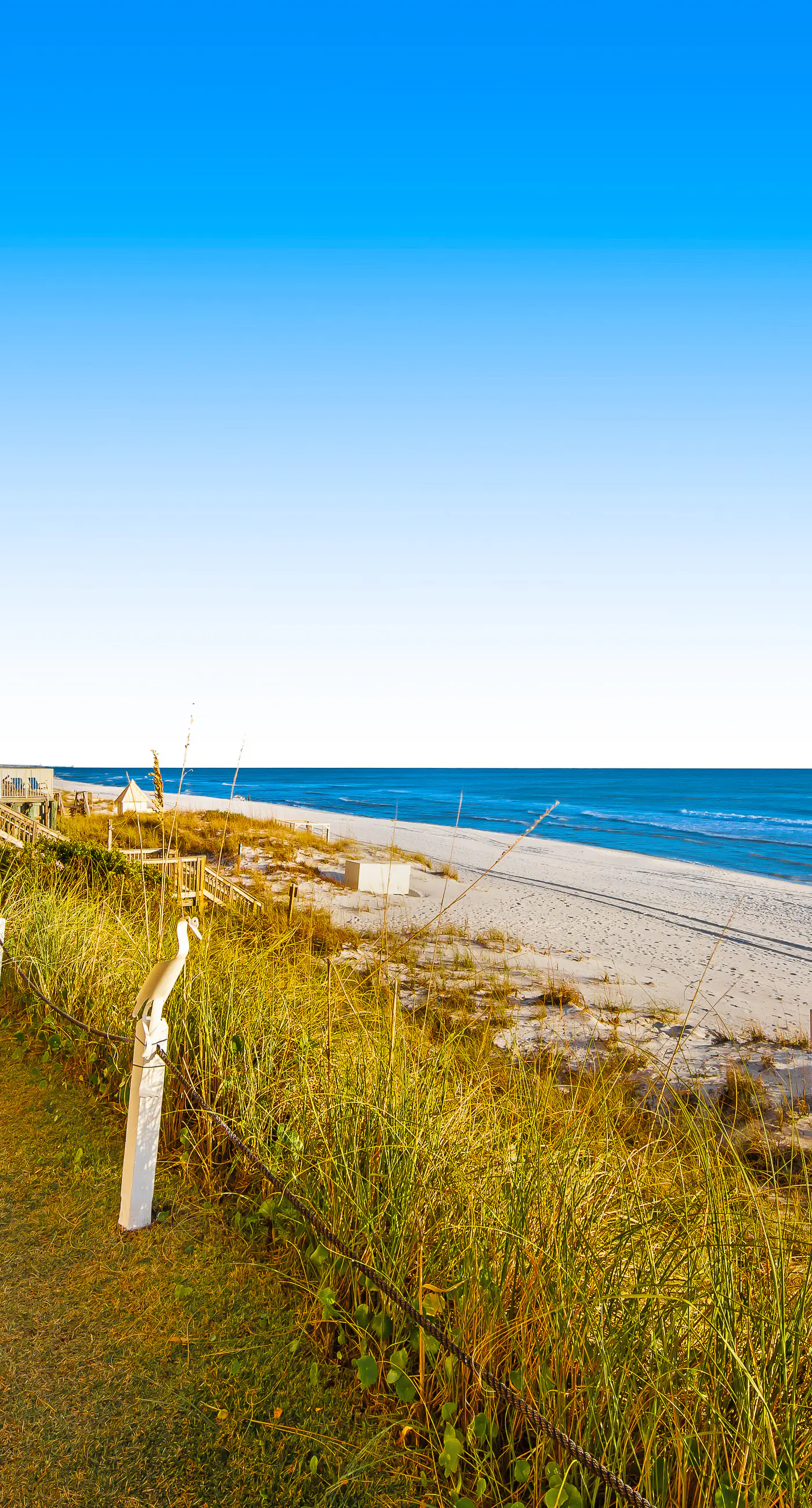 Ground floor oceanfront beachy condo with furnished patio, outdoor pool, gym