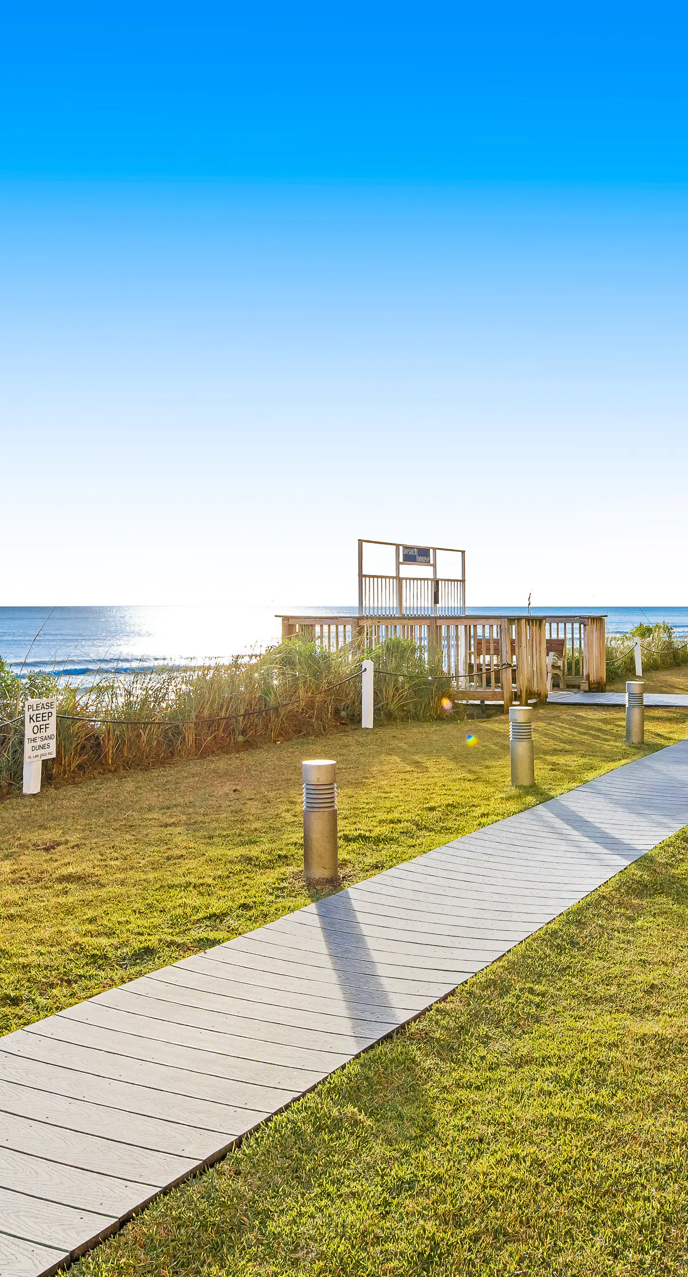 Ground floor oceanfront beachy condo with furnished patio, outdoor pool, gym