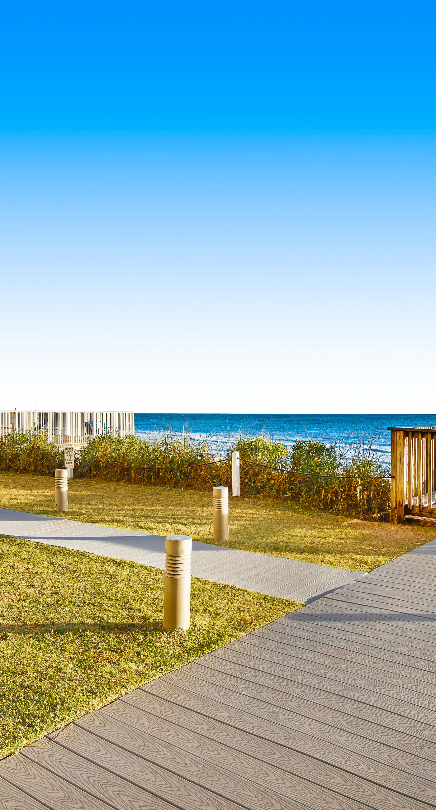 Ground floor oceanfront beachy condo with furnished patio, outdoor pool, gym