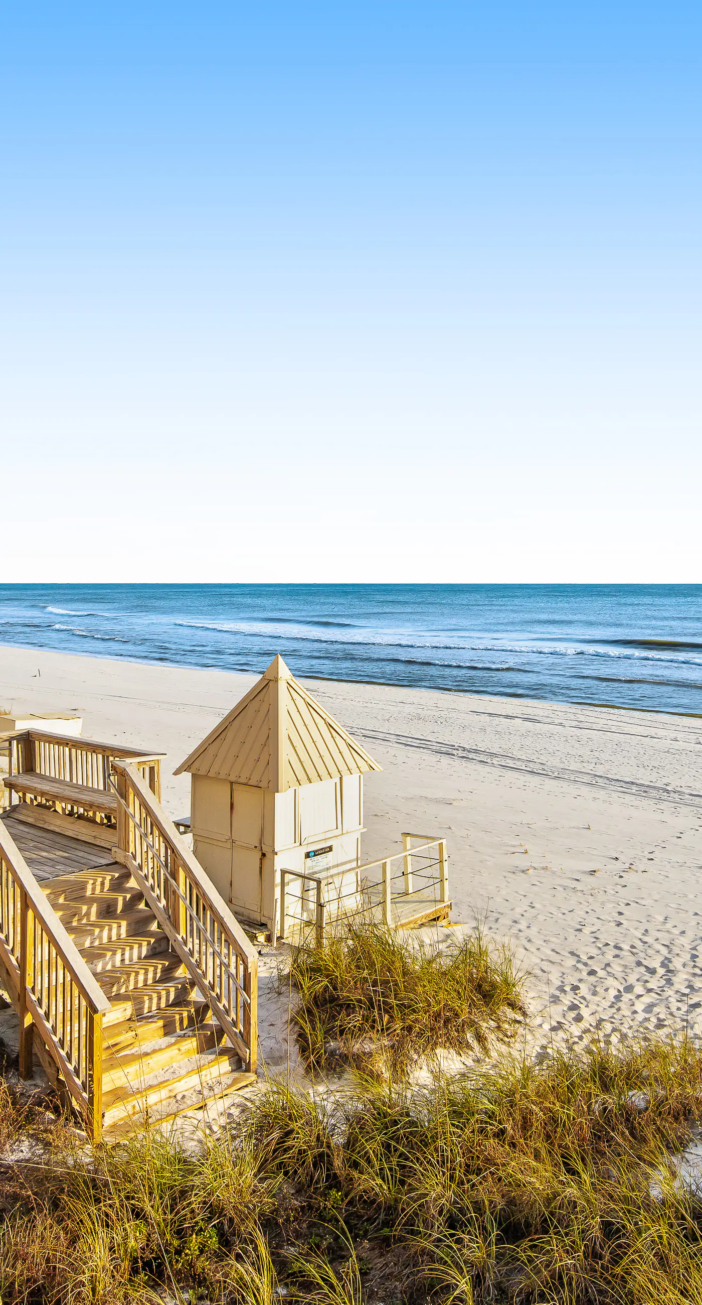 Ground floor oceanfront beachy condo with furnished patio, outdoor pool, gym