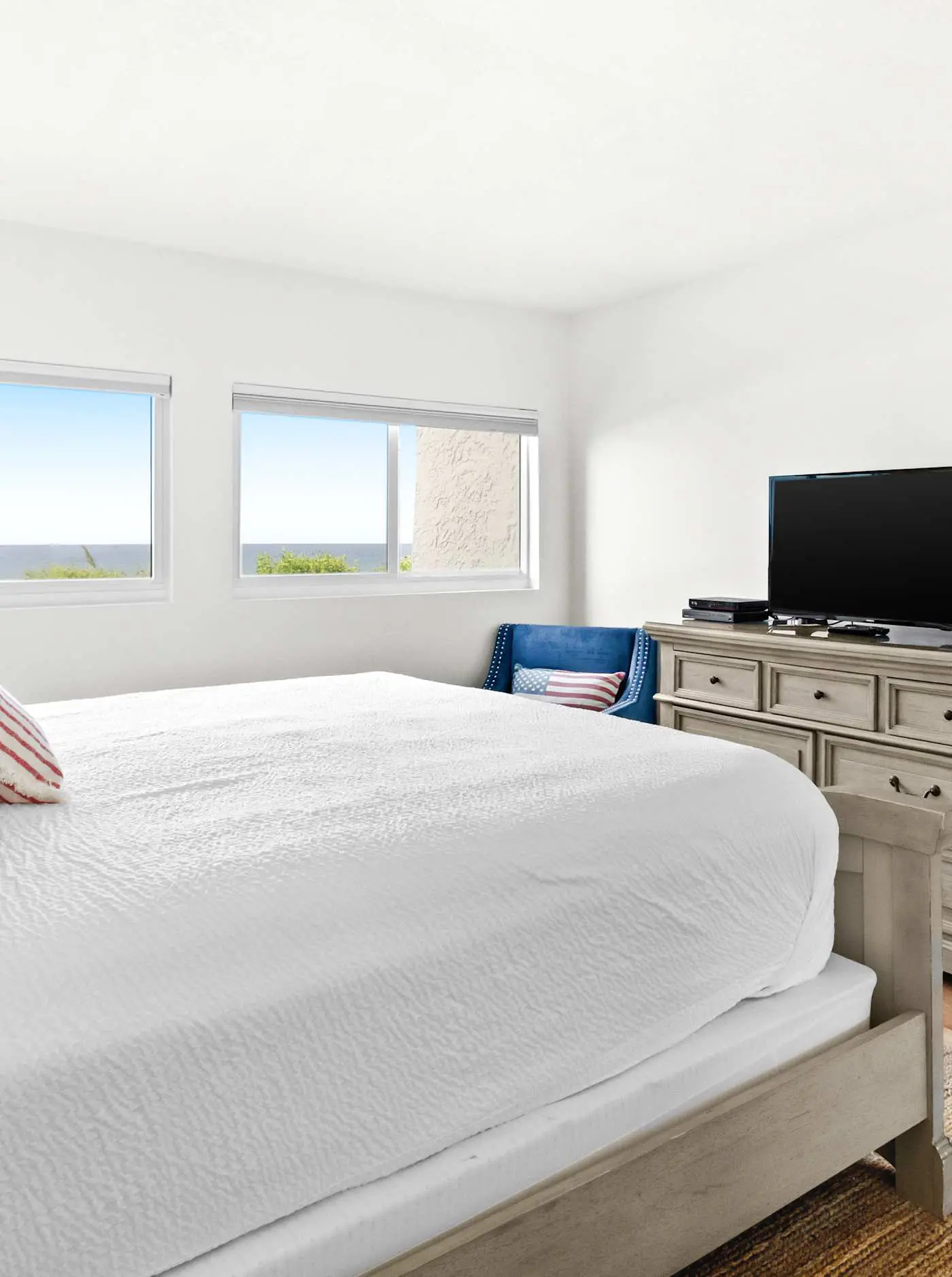 Ground floor oceanfront beachy condo with furnished patio, outdoor pool, gym
