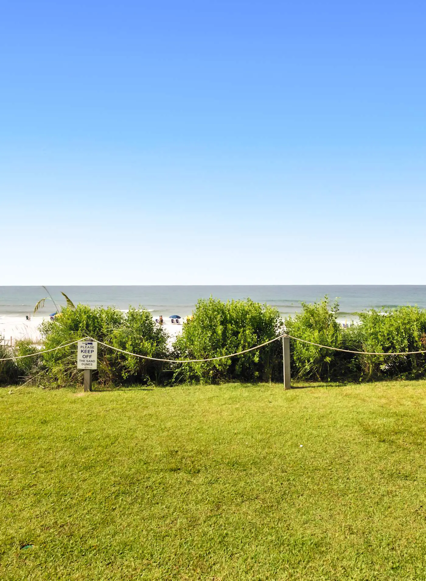 Ground floor oceanfront beachy condo with furnished patio, outdoor pool, gym