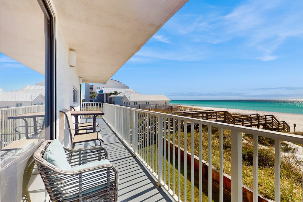Spacious beachfront condo with full kitchen, shared pool and beach access