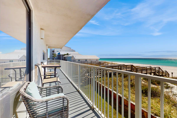 Spacious beachfront condo with full kitchen, shared pool and beach access