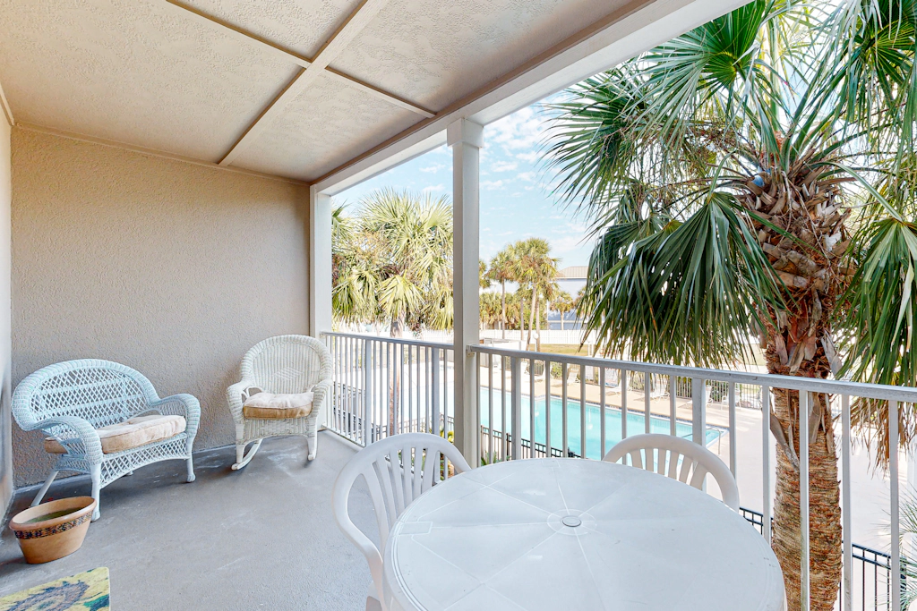Sunny condo with pool, hot tub, pool views, balcony, & AC