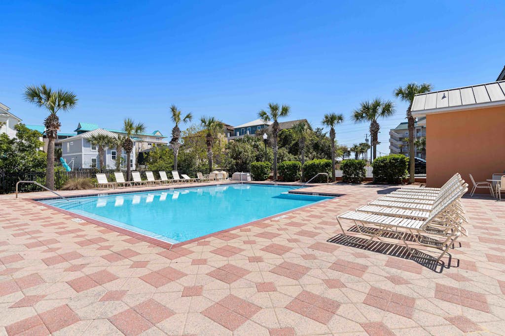 Elegant townhome with balconies, patio, pool & private beach access
