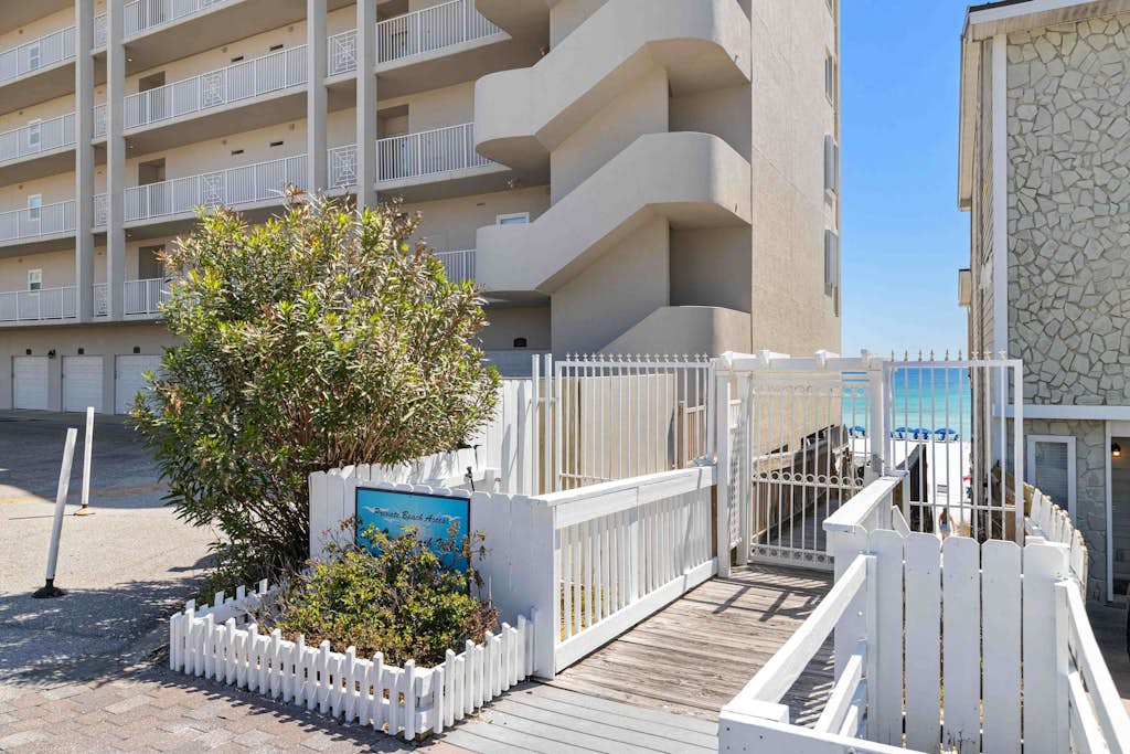 Elegant townhome with balconies, patio, pool & private beach access