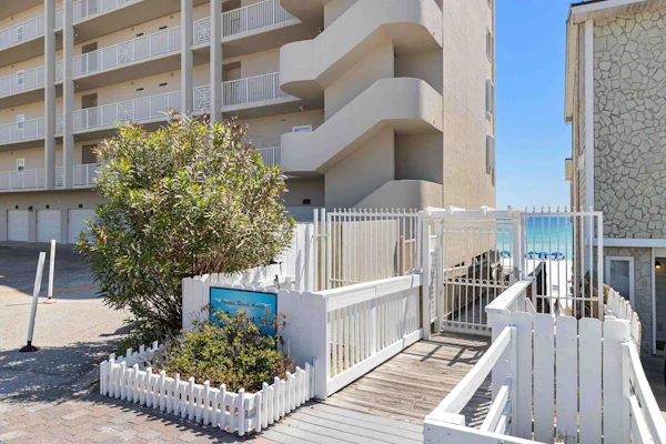 Elegant townhome with balconies, patio, pool & private beach access