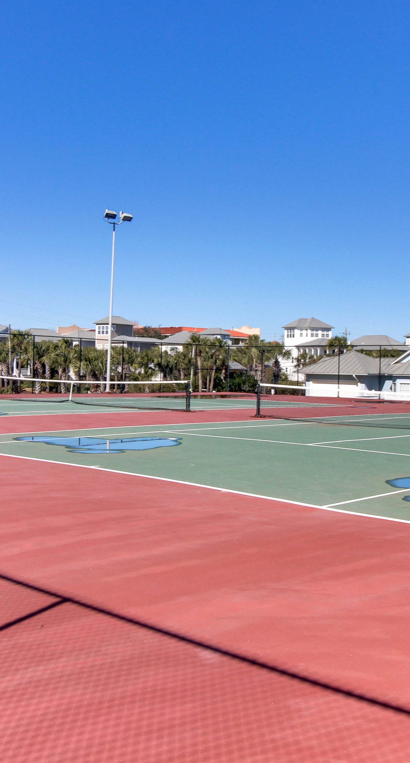 Gulf-view condo with balcony, pools, hot tub, beach access, & sports courts