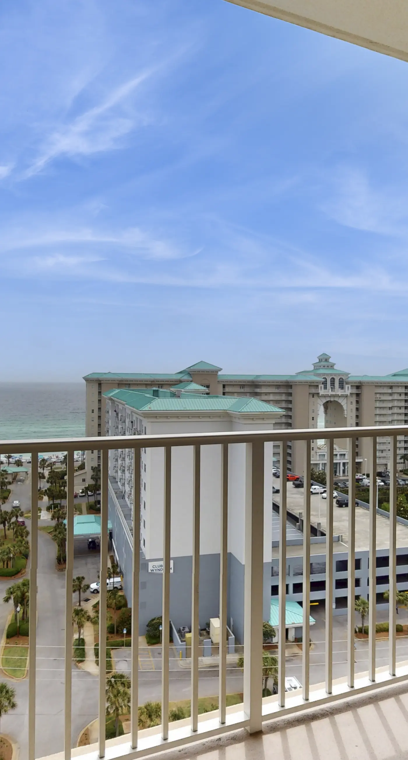 Family-friendly 13th-floor condo with furnished balcony, shared tennis, and pool