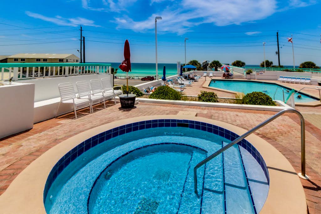 Experience the ultimate beach getaway at this charming one bedroom condo located at Surfside Resort in Miramar Beach. Perfectly positioned just steps from the pristine sands of the Gulf of Mexico, this single level retreat offers a relaxing atmosphere with access to fantastic resort amenities including an outdoor pool, hot tub, gym, and tennis courts. Whether you are looking to lounge by the water, explore local shopping, or enjoy the on site spa, salon, or restaurant, this family friendly home provides the ideal base for your Florida vacation.