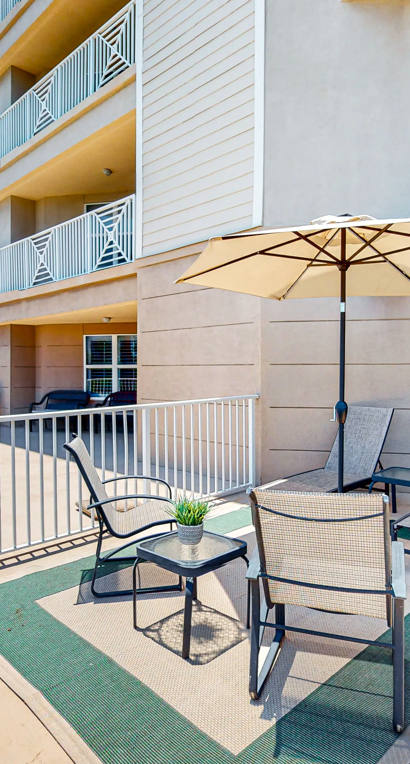 Ground-floor condo with large patio, pools, tennis, & parking - steps to beach