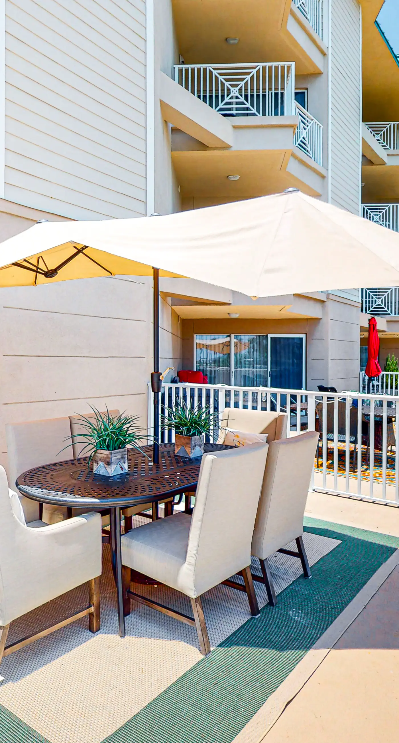 Ground-floor condo with large patio, pools, tennis, & parking - steps to beach