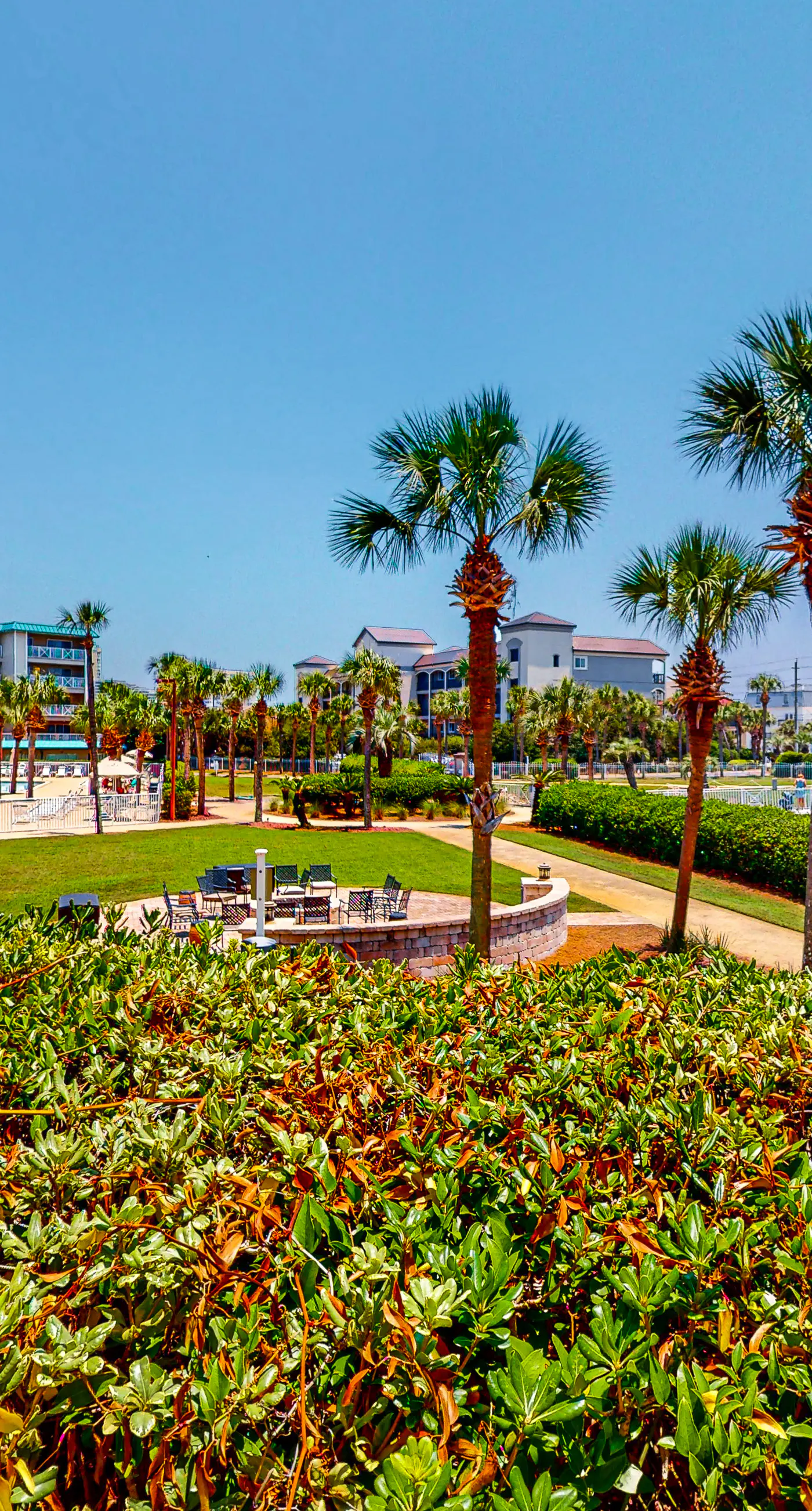 Ground-floor condo with large patio, pools, tennis, & parking - steps to beach