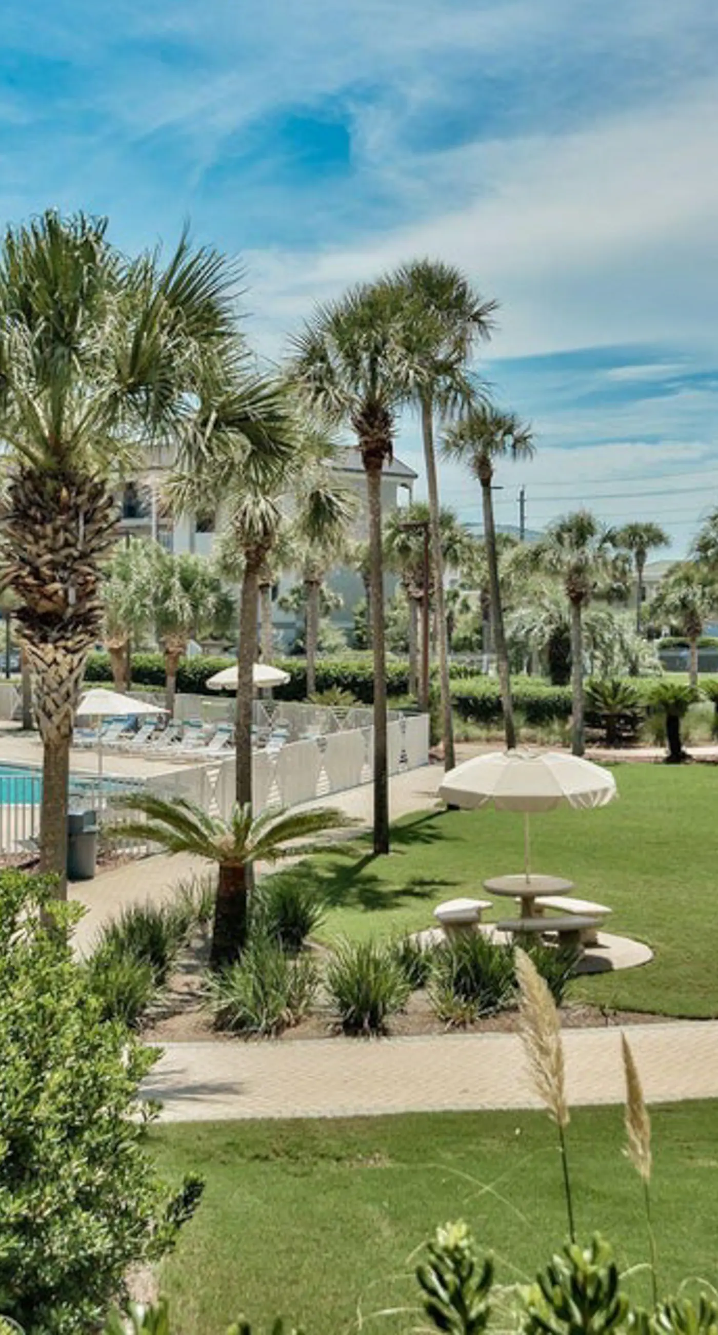 Ground-floor condo with large patio, pools, tennis, & parking - steps to beach