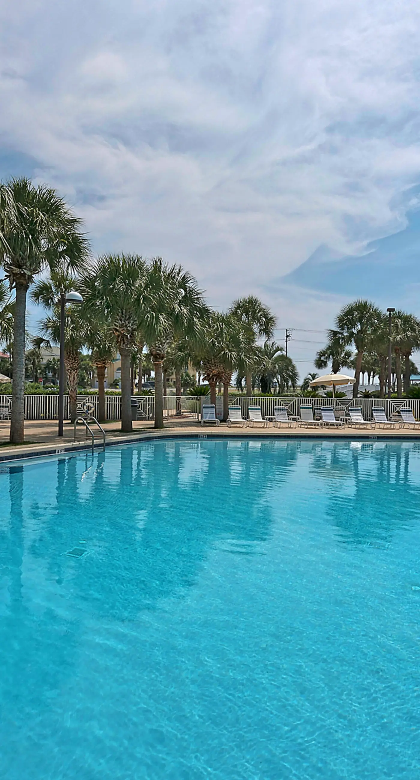 Ocean view condo with high-speed WiFi, balcony, shared pool, & beach access