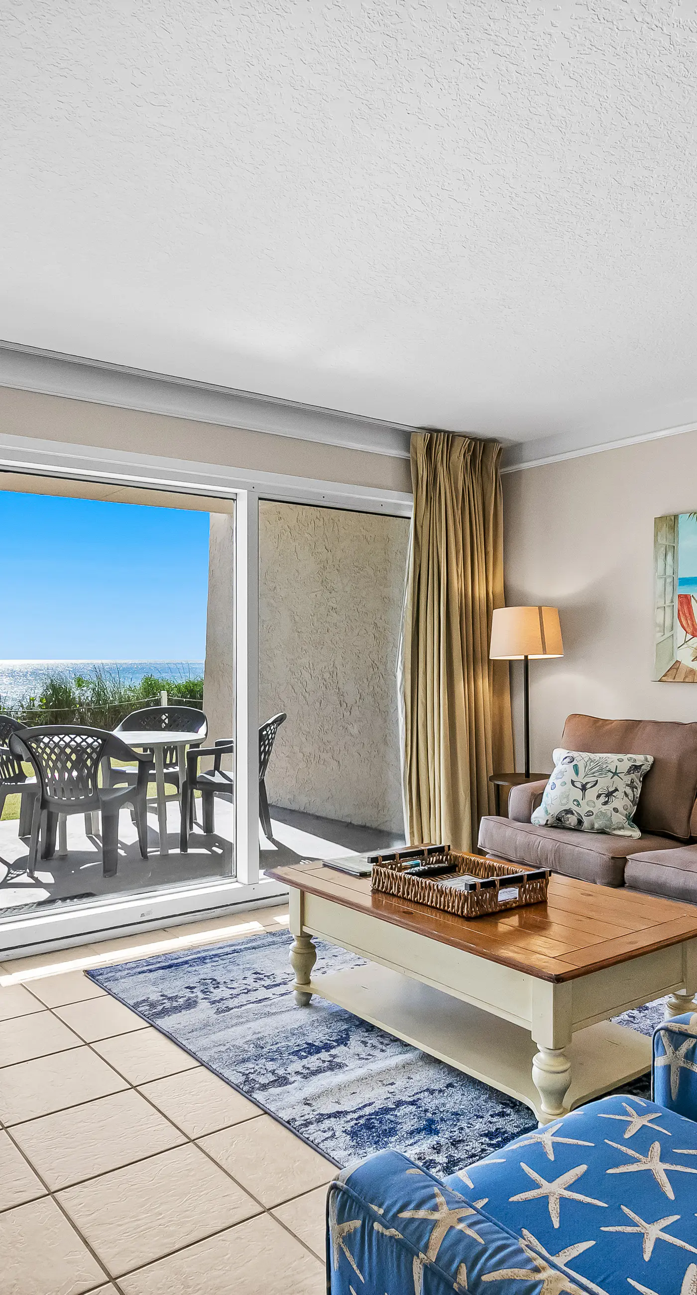 Gulf and beachfront condo with furnished patio, outdoor pool, gym & tennis