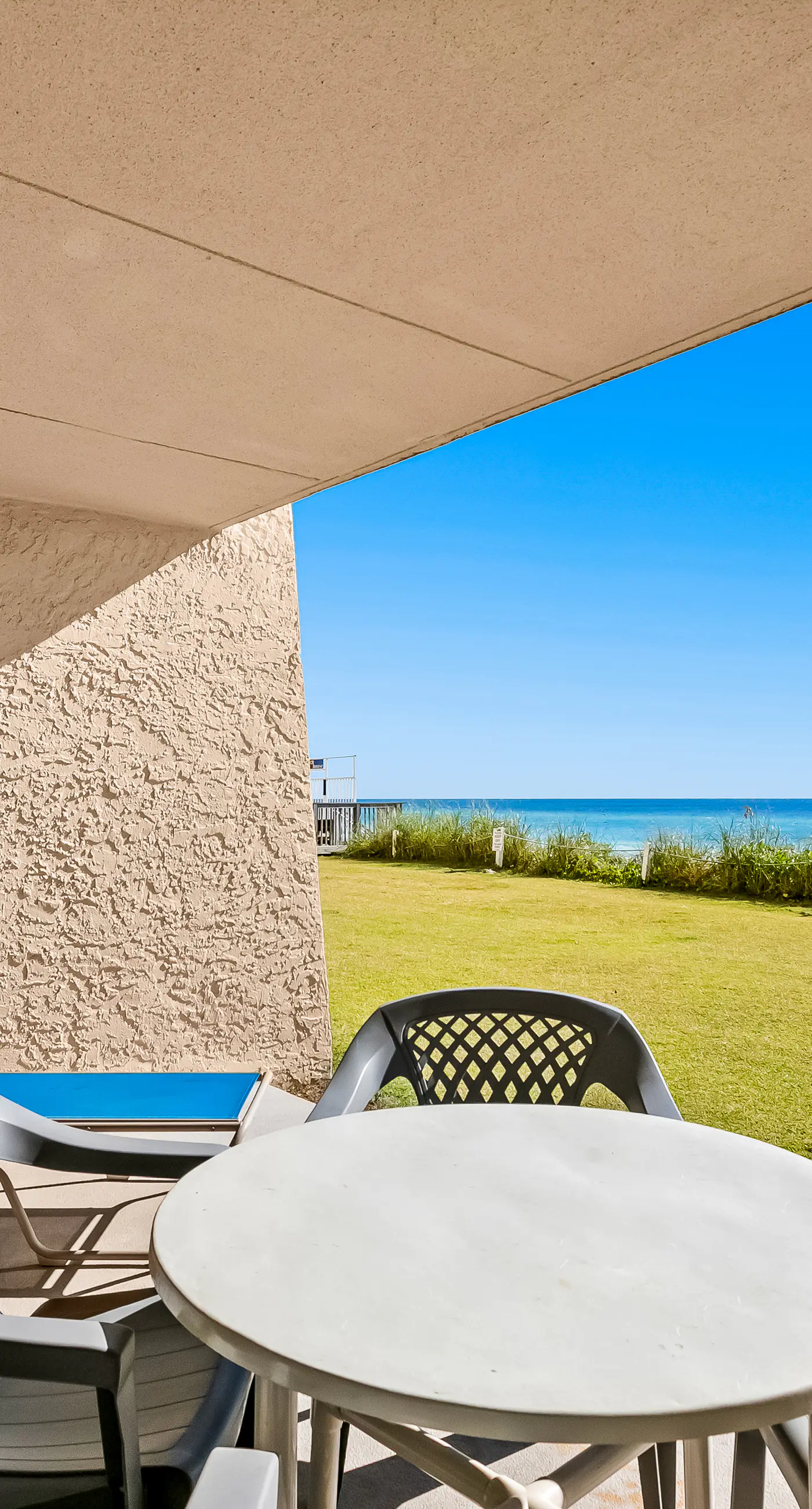 Gulf and beachfront condo with furnished patio, outdoor pool, gym & tennis