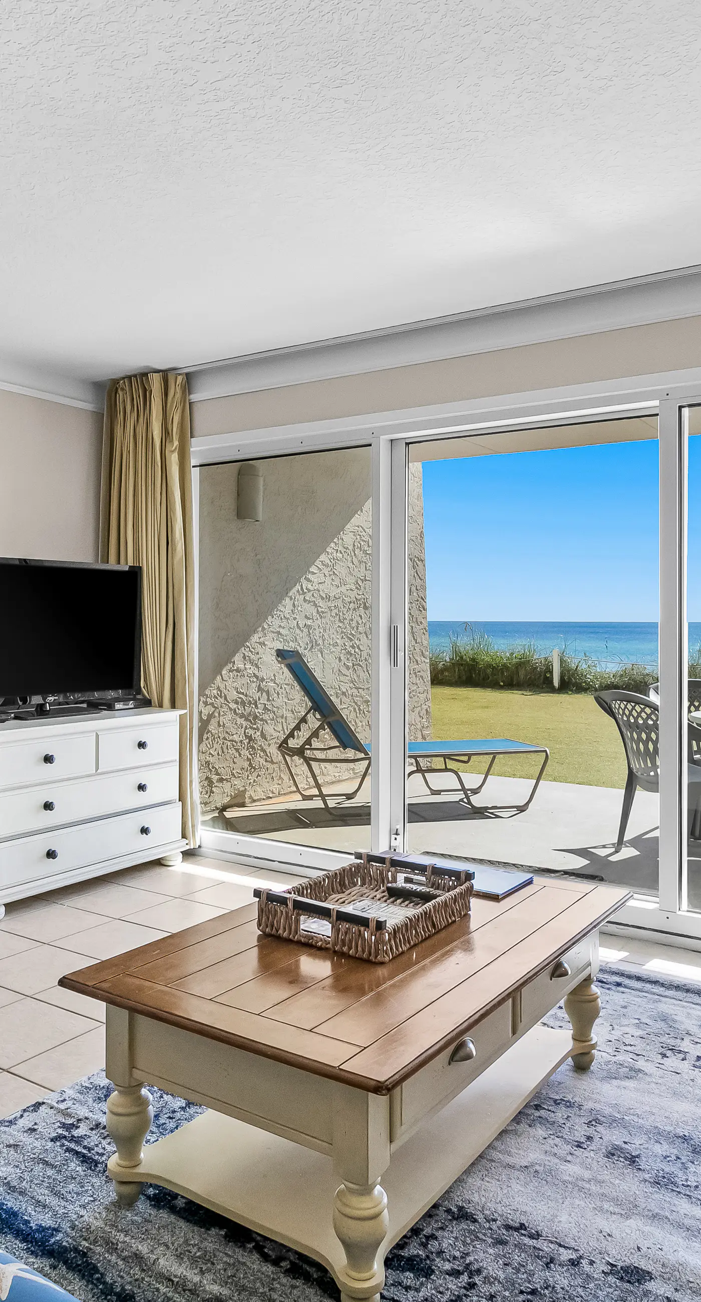 Gulf and beachfront condo with furnished patio, outdoor pool, gym & tennis