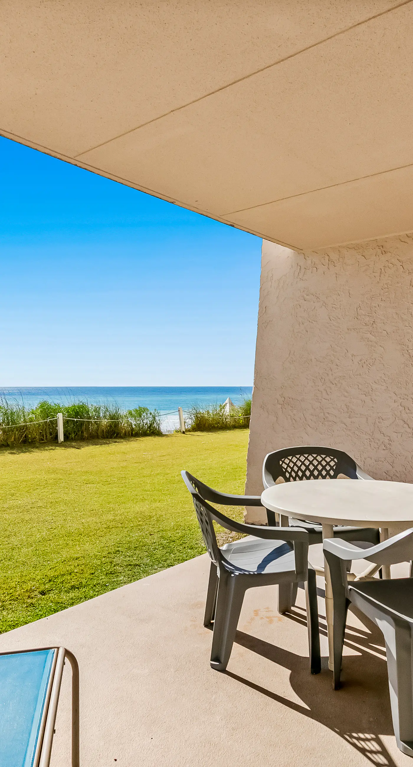 Gulf and beachfront condo with furnished patio, outdoor pool, gym & tennis