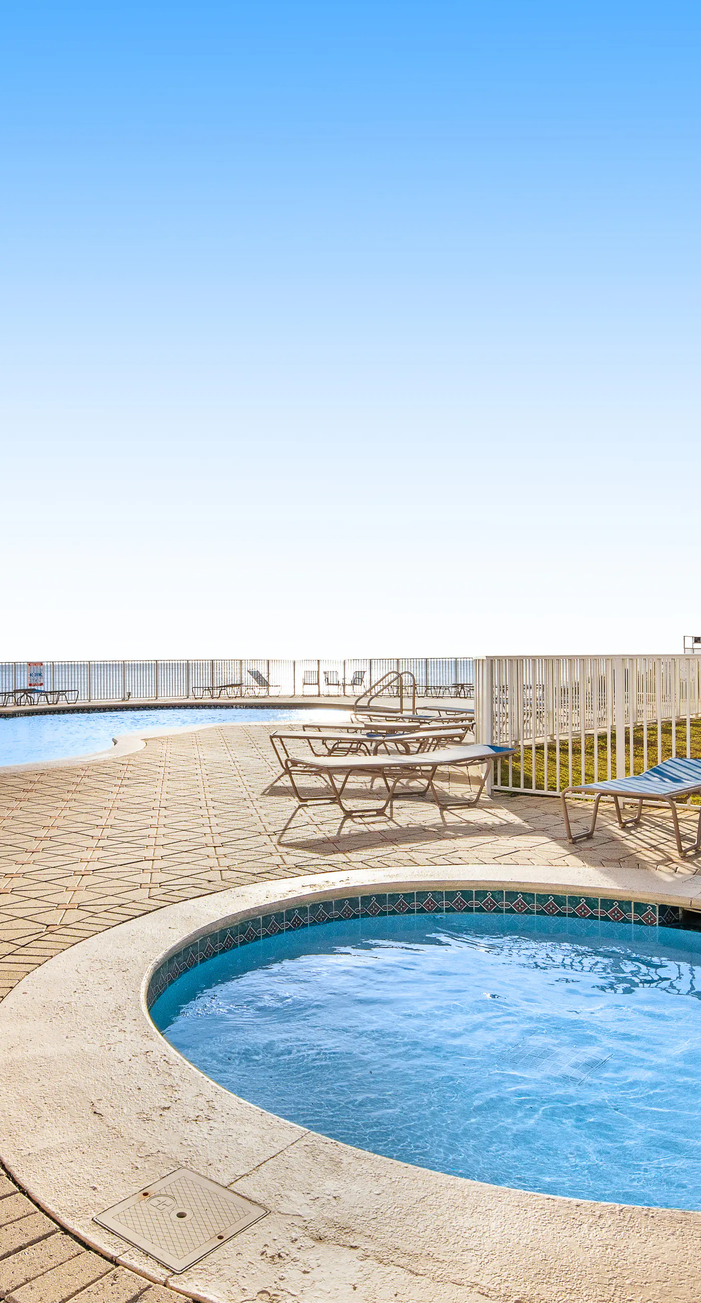 Gulf and beachfront condo with furnished patio, outdoor pool, gym & tennis