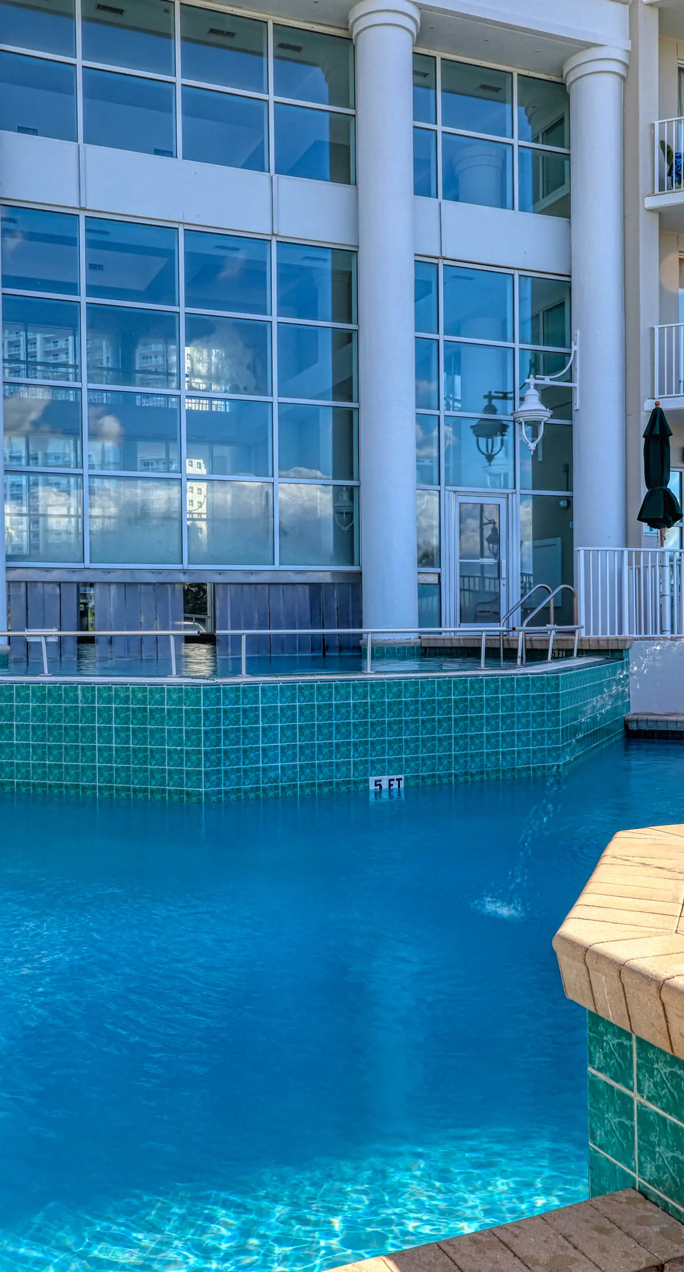 Gulf front getaway w/ a furnished balcony, shared pool, & resort amenities