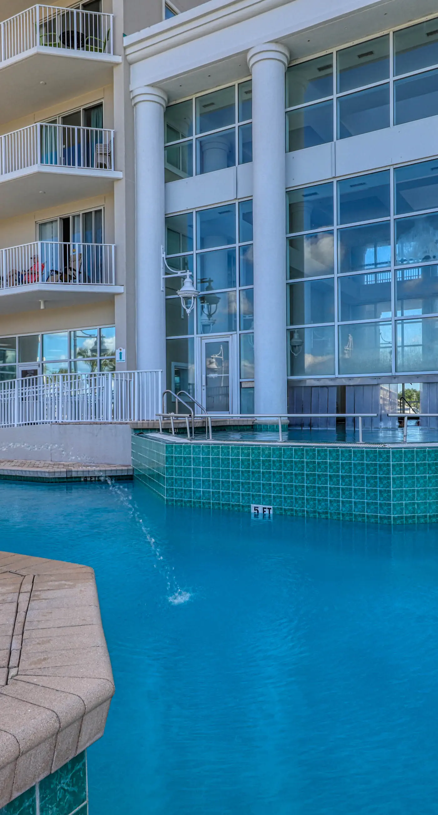 Gulf front getaway w/ a furnished balcony, shared pool, & resort amenities
