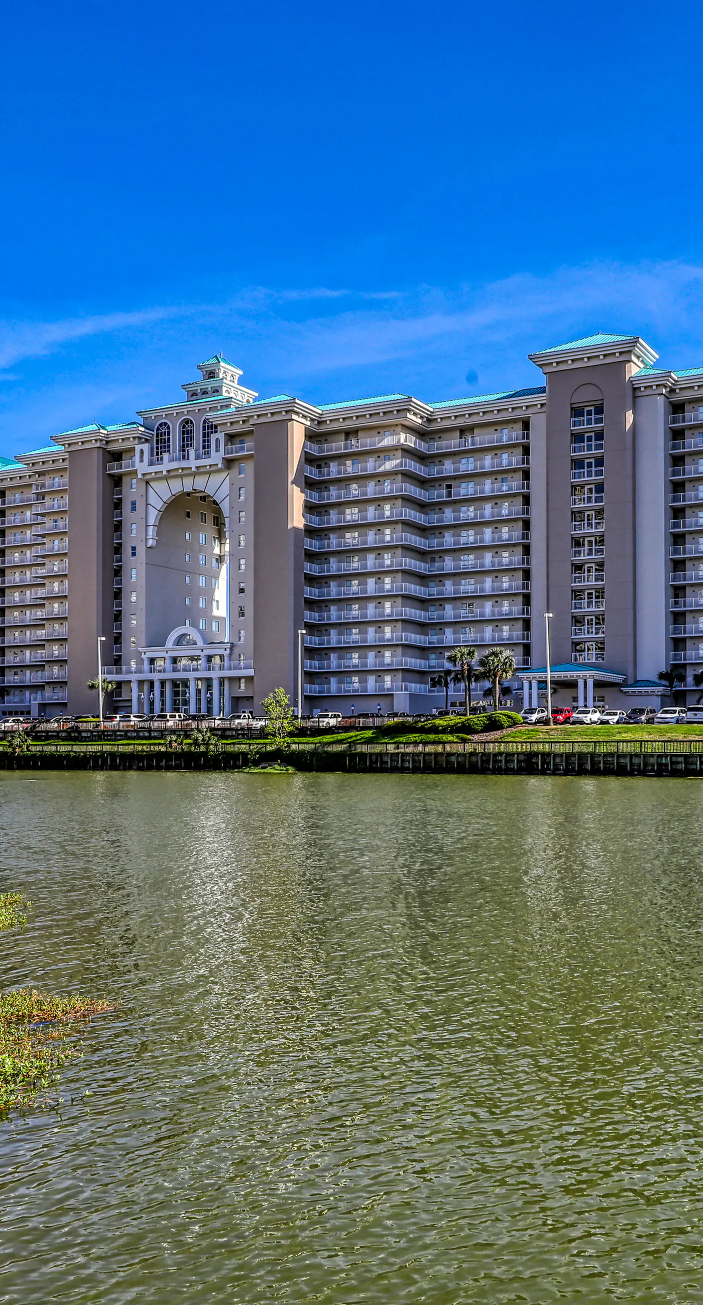 Gulf front getaway w/ a furnished balcony, shared pool, & resort amenities