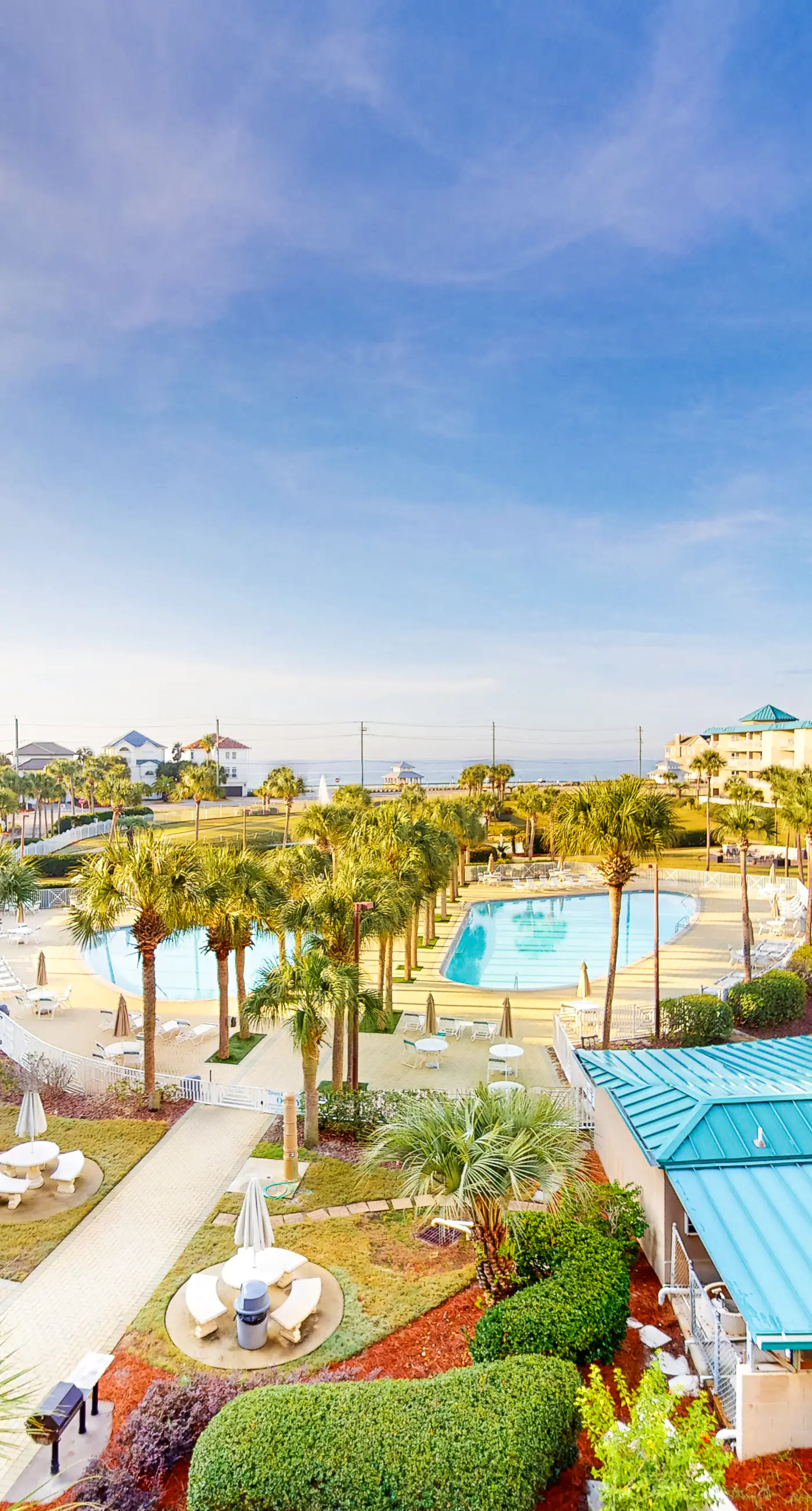 Bright & comfortable gulf-side condo overlooking beach with WiFi, pool, central AC