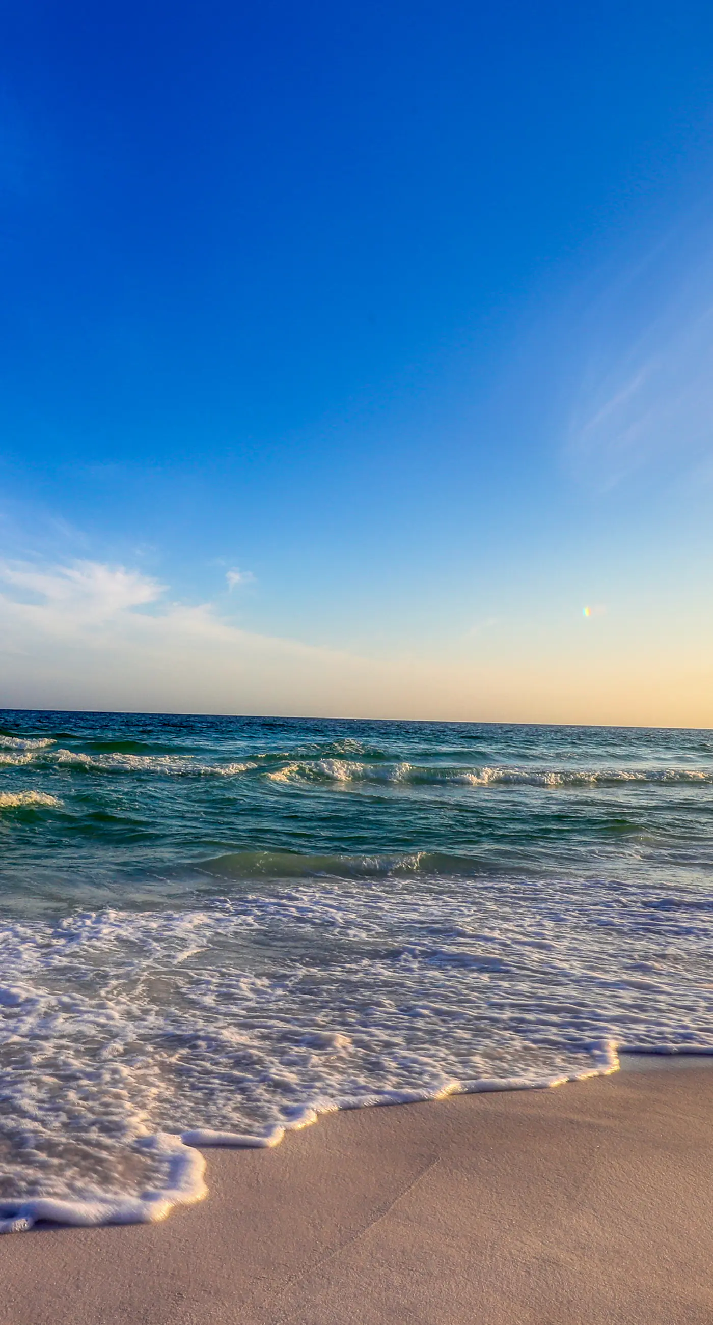 Colorful, third-floor condo w/partial gulf views, shared outdoor pool and tennis