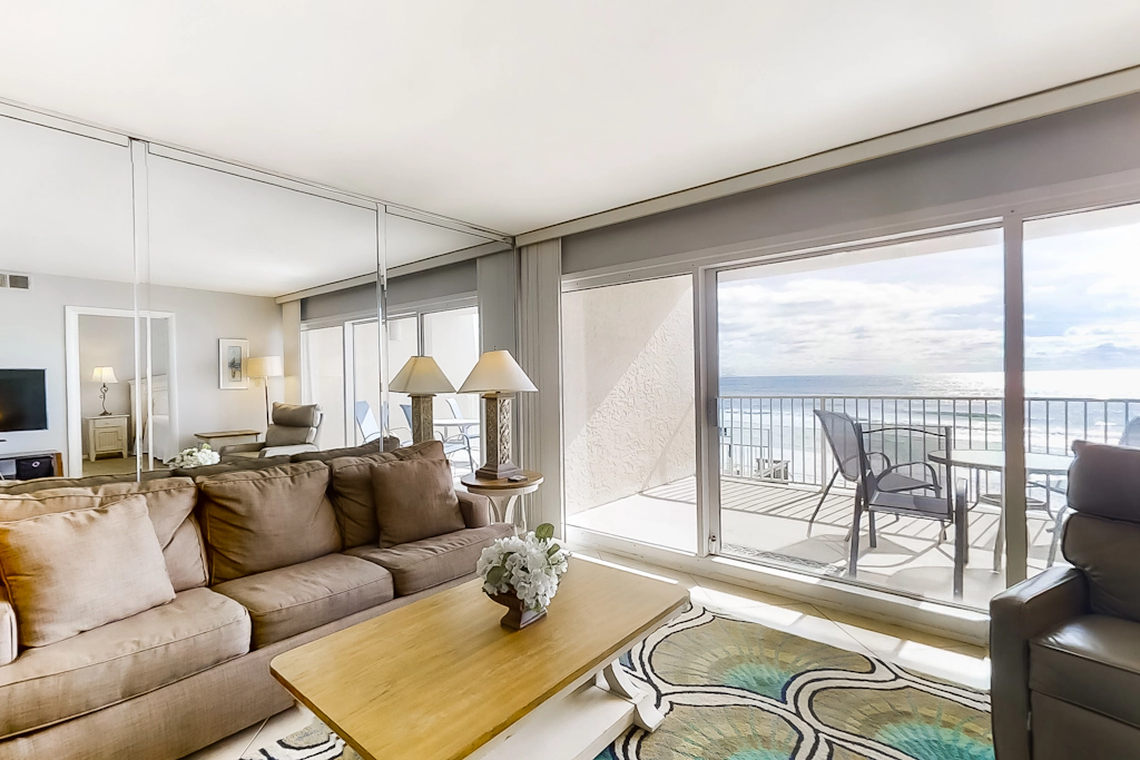 Spacious beachfront condo on second floor with balcony, beach views & pool
