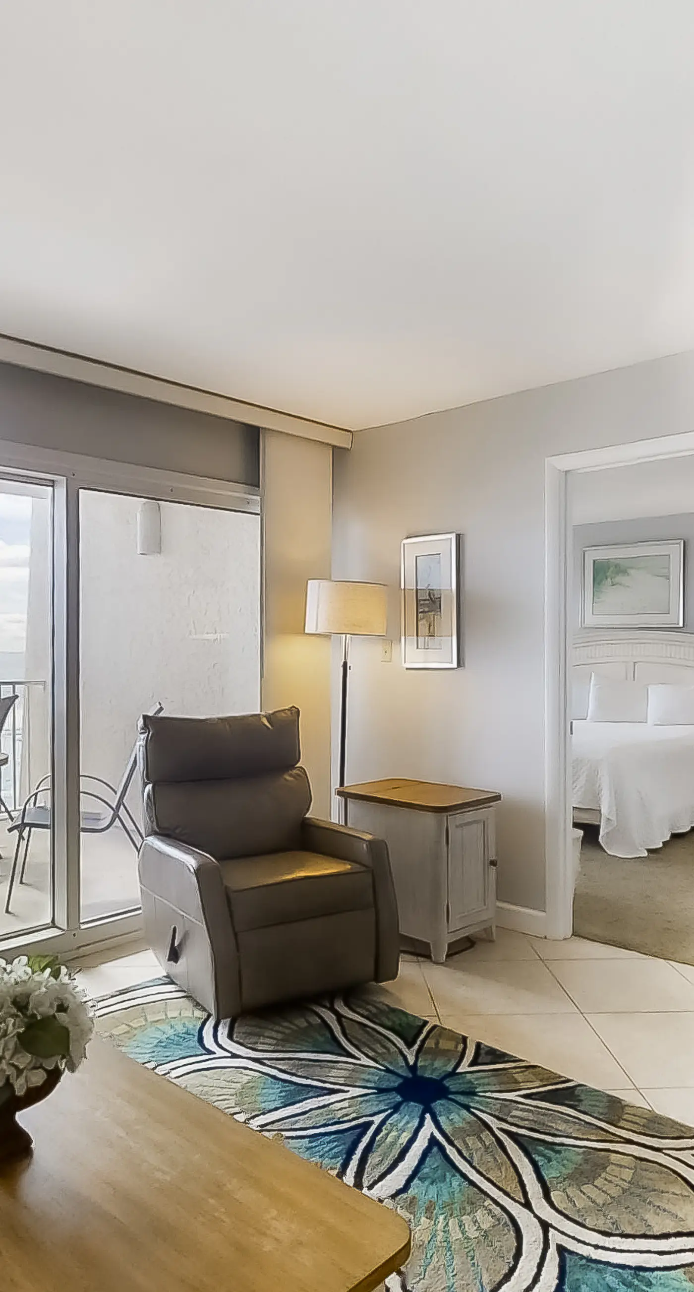 Spacious beachfront condo on second floor with balcony, beach views & pool