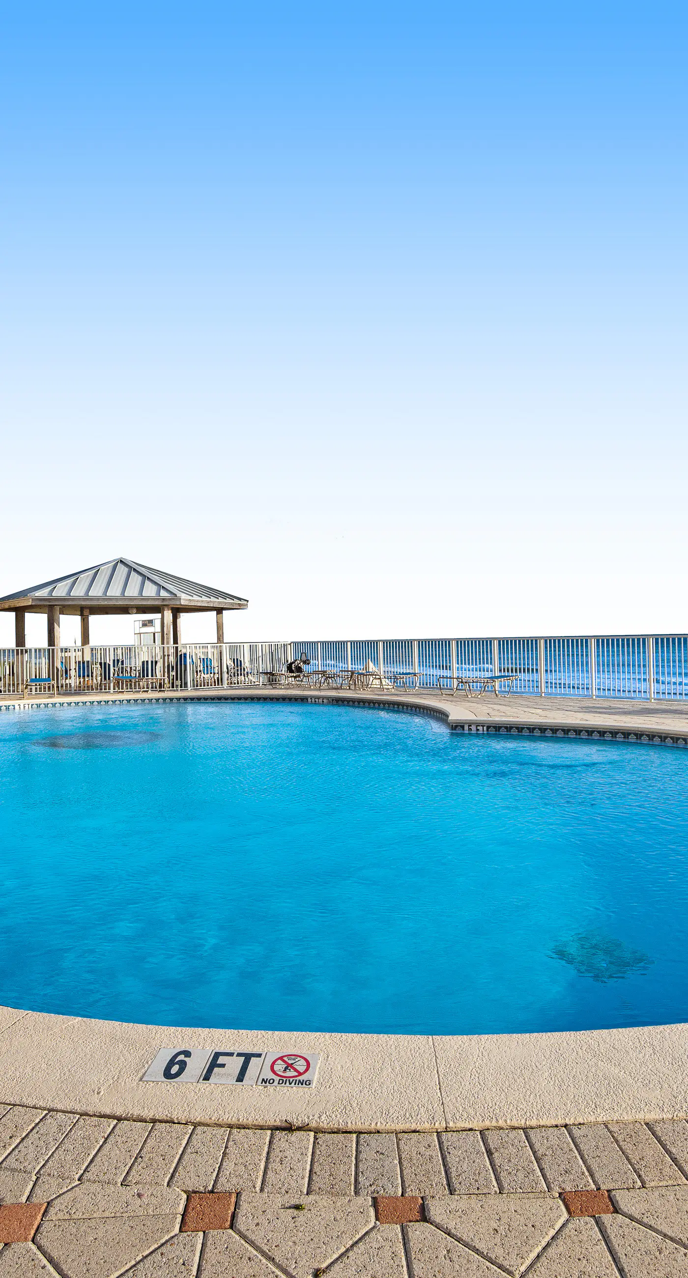 Spacious beachfront condo on second floor with balcony, beach views & pool