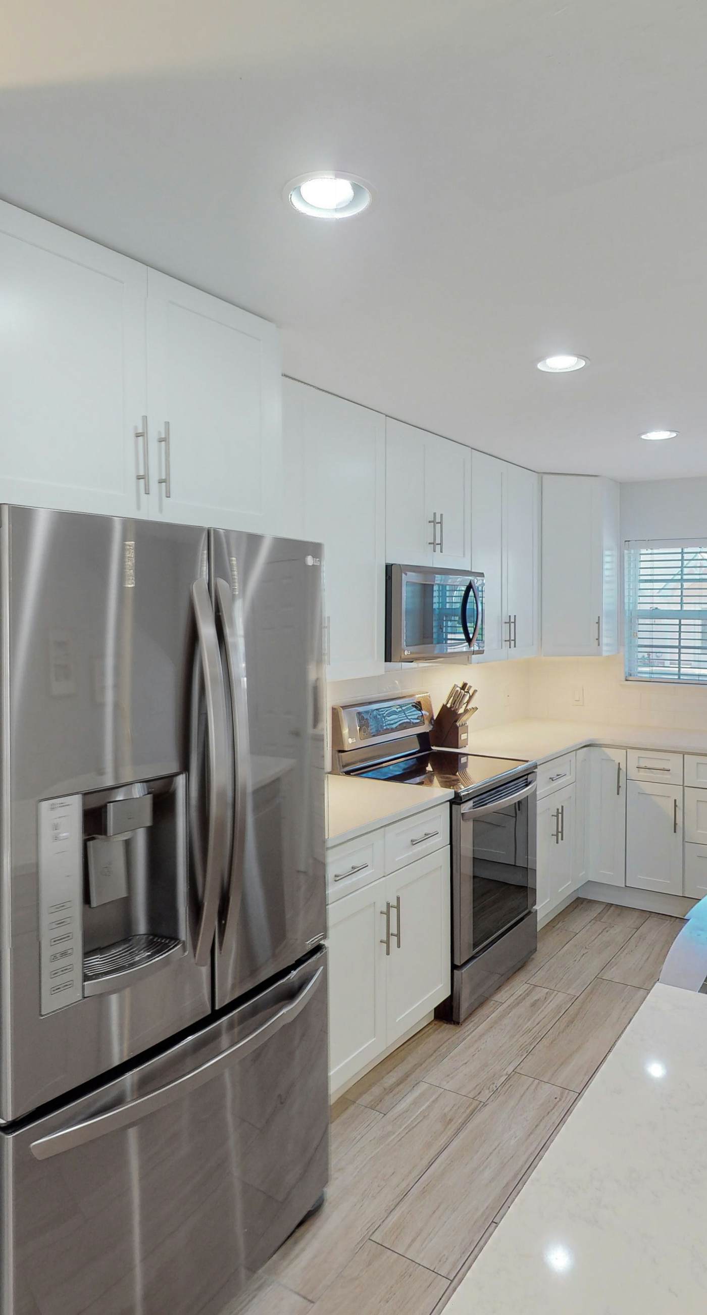 Dog-friendly townhouse near the beach with outdoor pool, water views, & AC