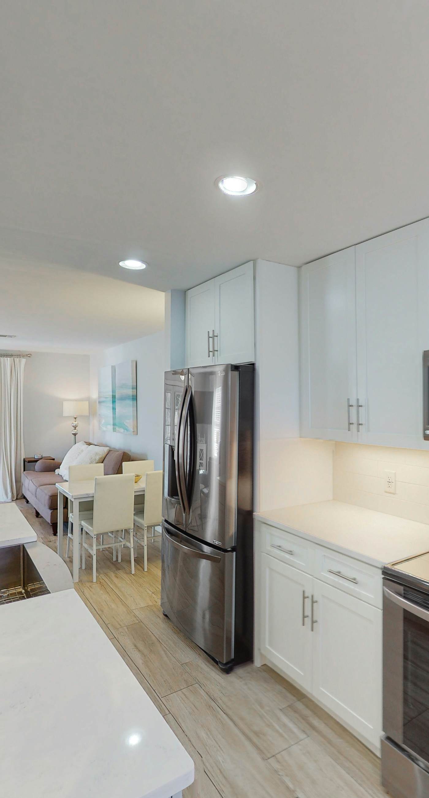 Dog-friendly townhouse near the beach with outdoor pool, water views, & AC