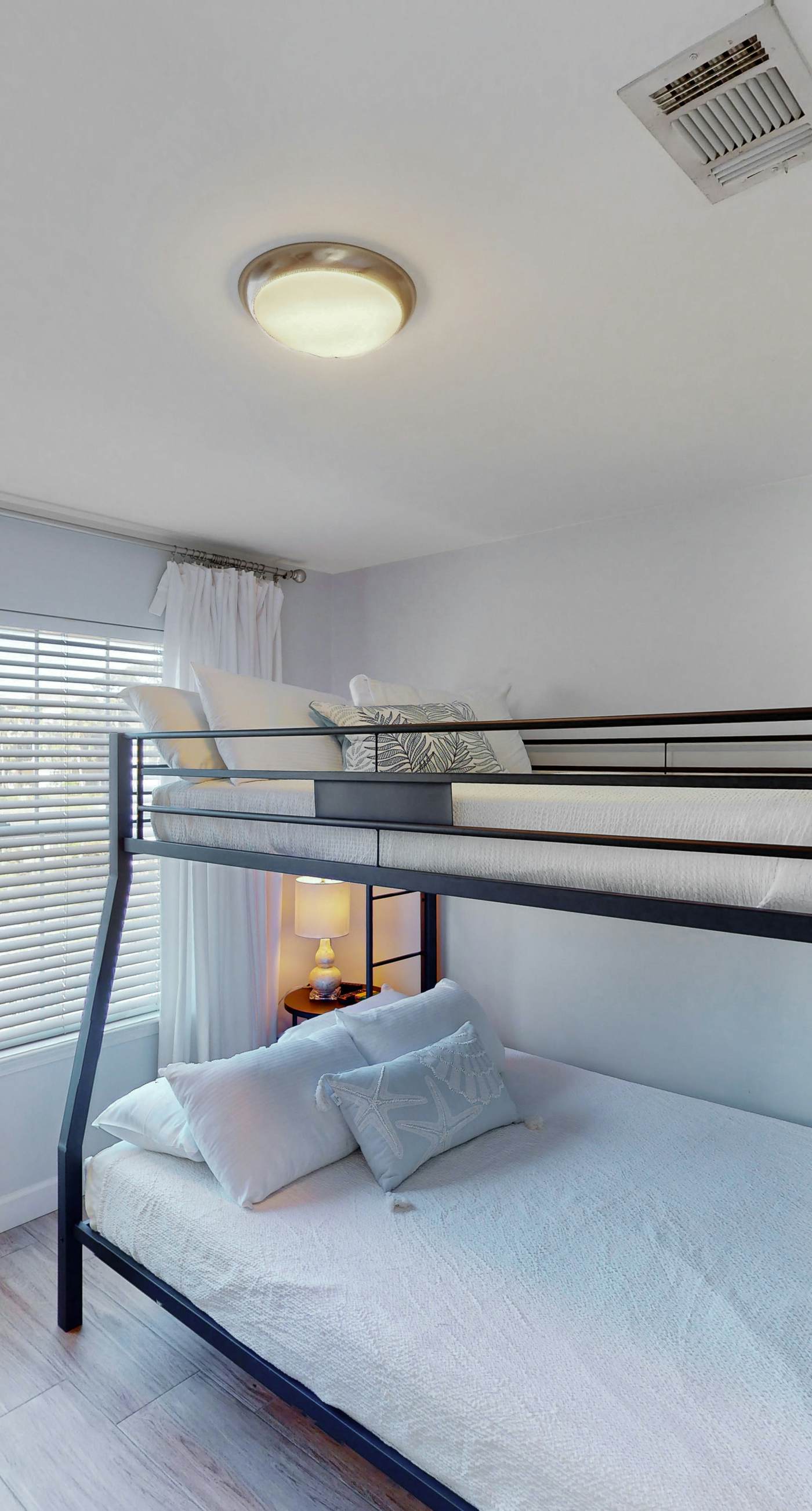 Dog-friendly townhouse near the beach with outdoor pool, water views, & AC