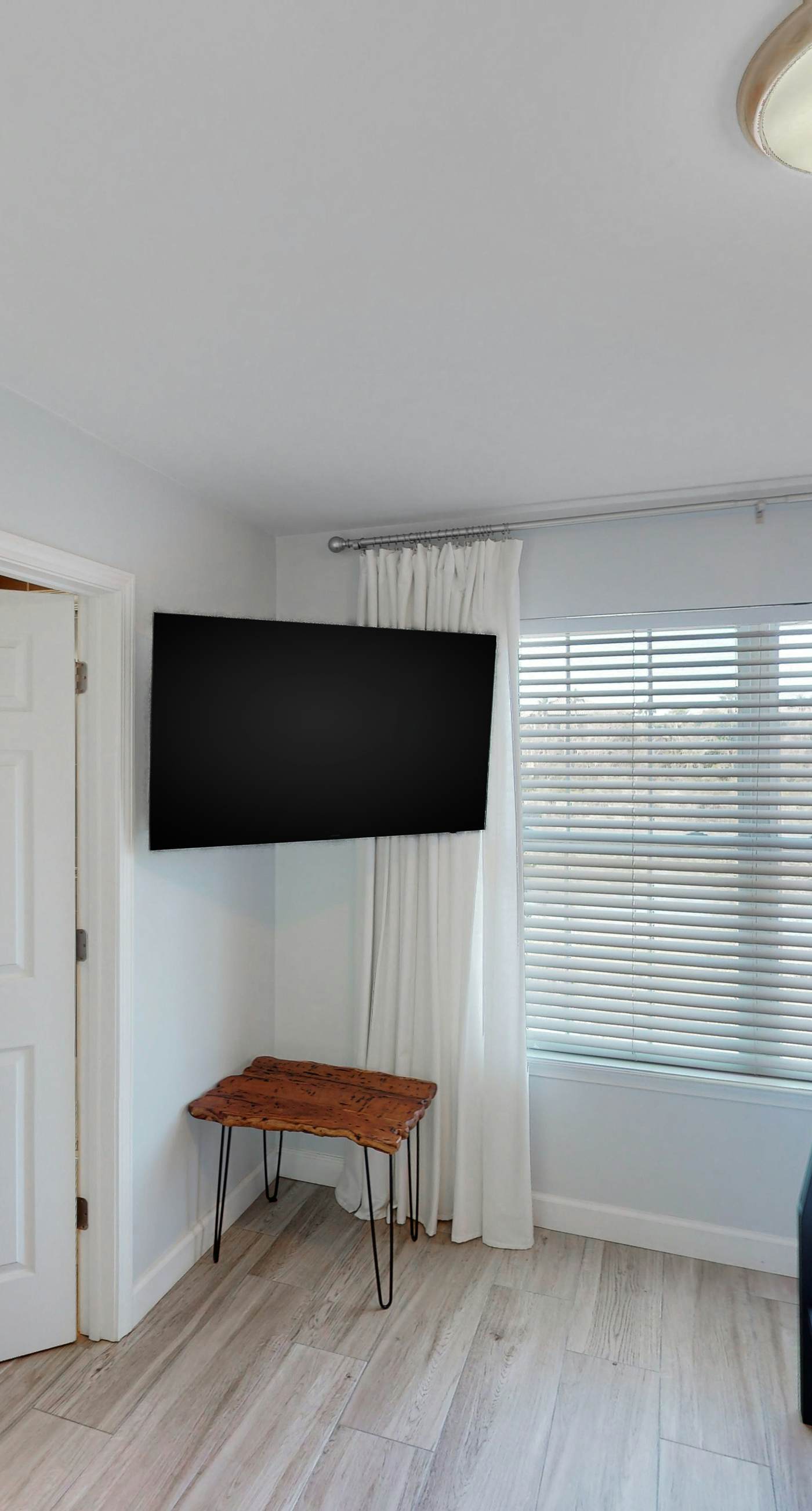 Dog-friendly townhouse near the beach with outdoor pool, water views, & AC