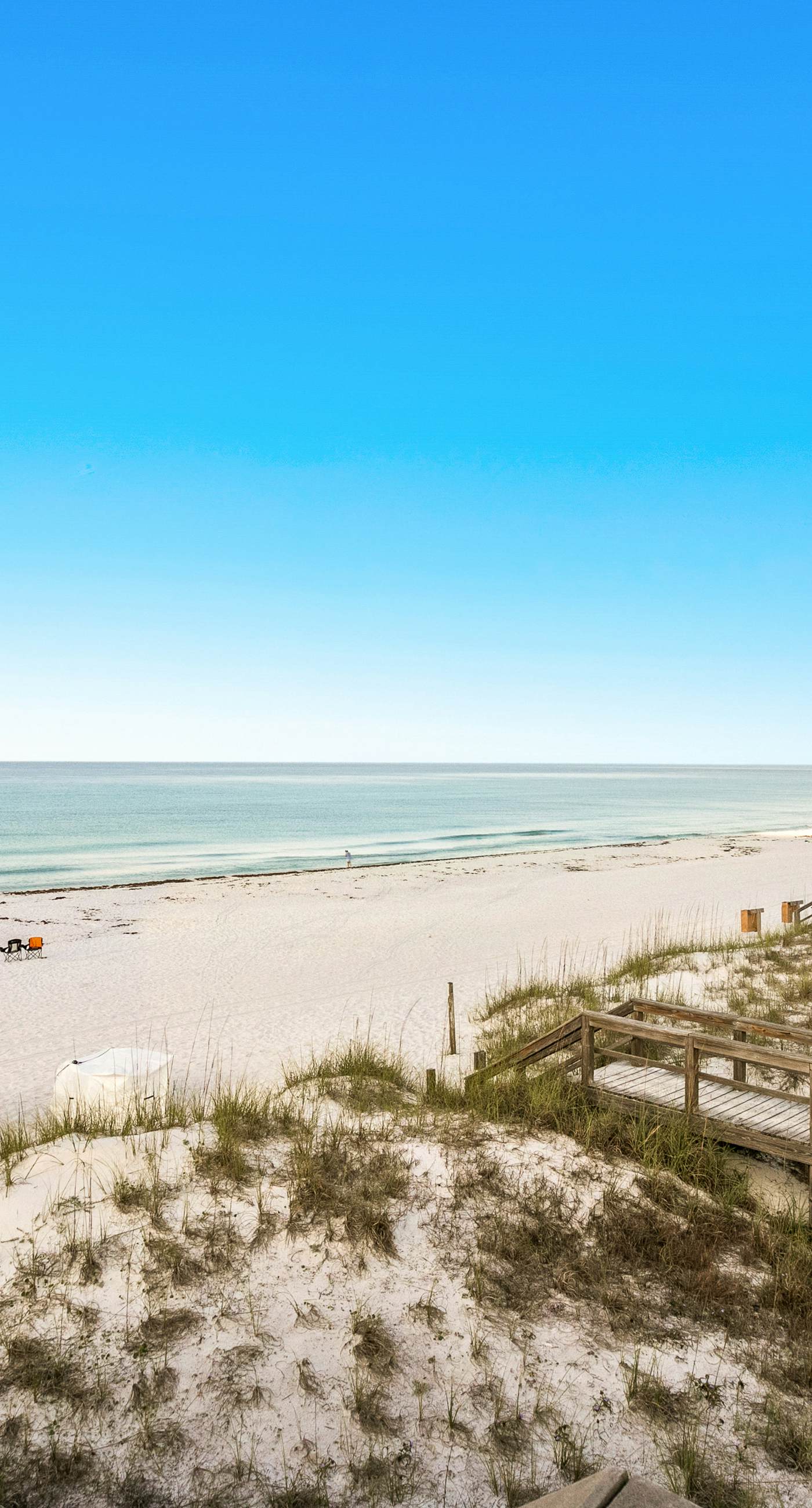 Dog-friendly townhouse near the beach with outdoor pool, water views, & AC