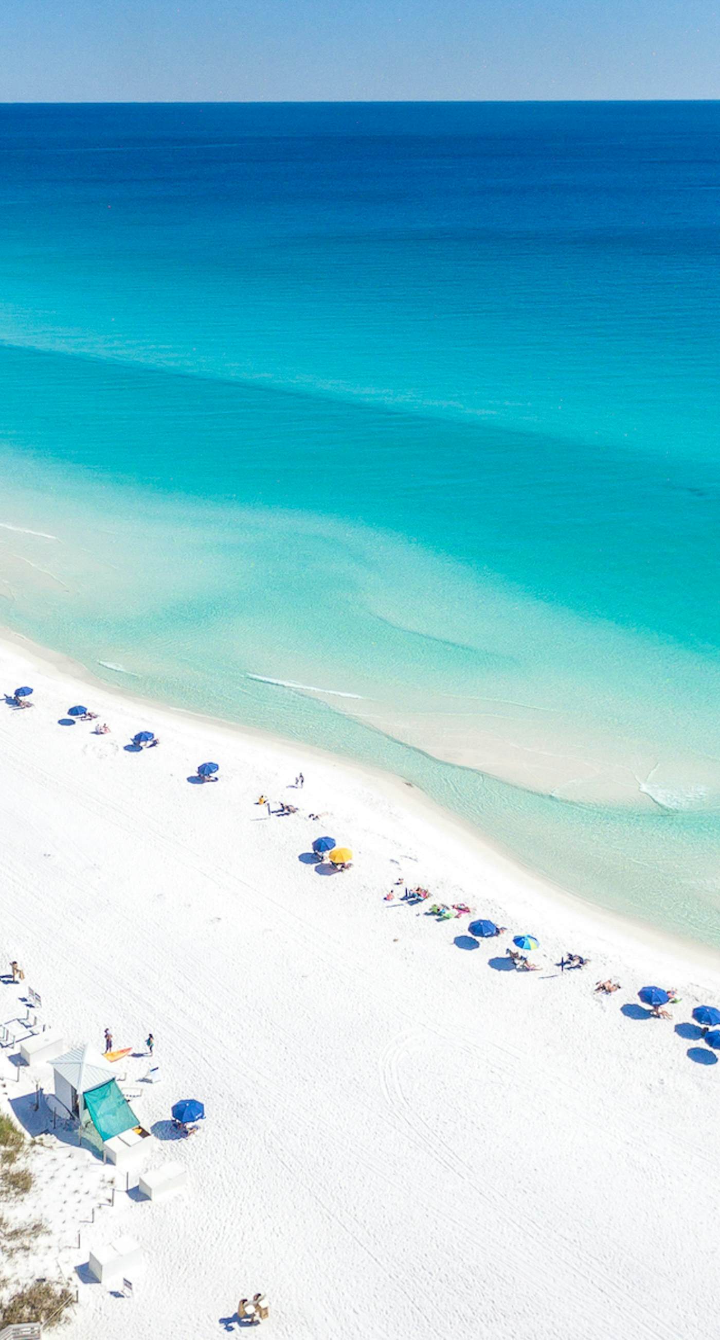 Dog-friendly townhouse near the beach with outdoor pool, water views, & AC