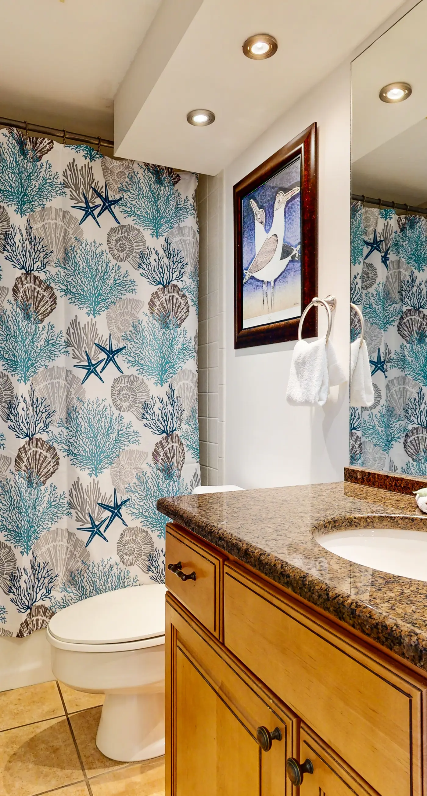 Cozy coastal condo with balcony, beach views, & resort pool