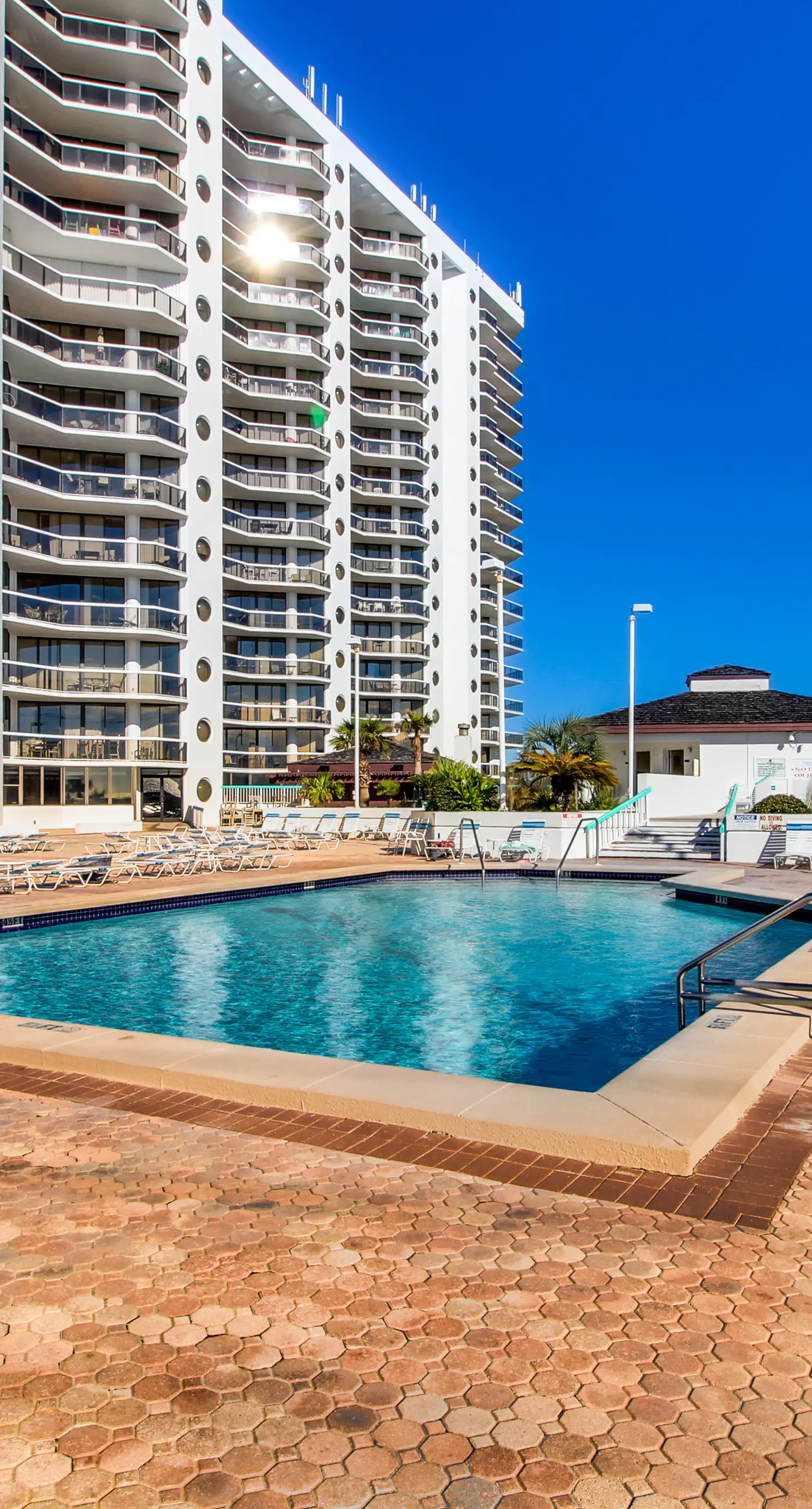 Cozy coastal condo with balcony, beach views, & resort pool
